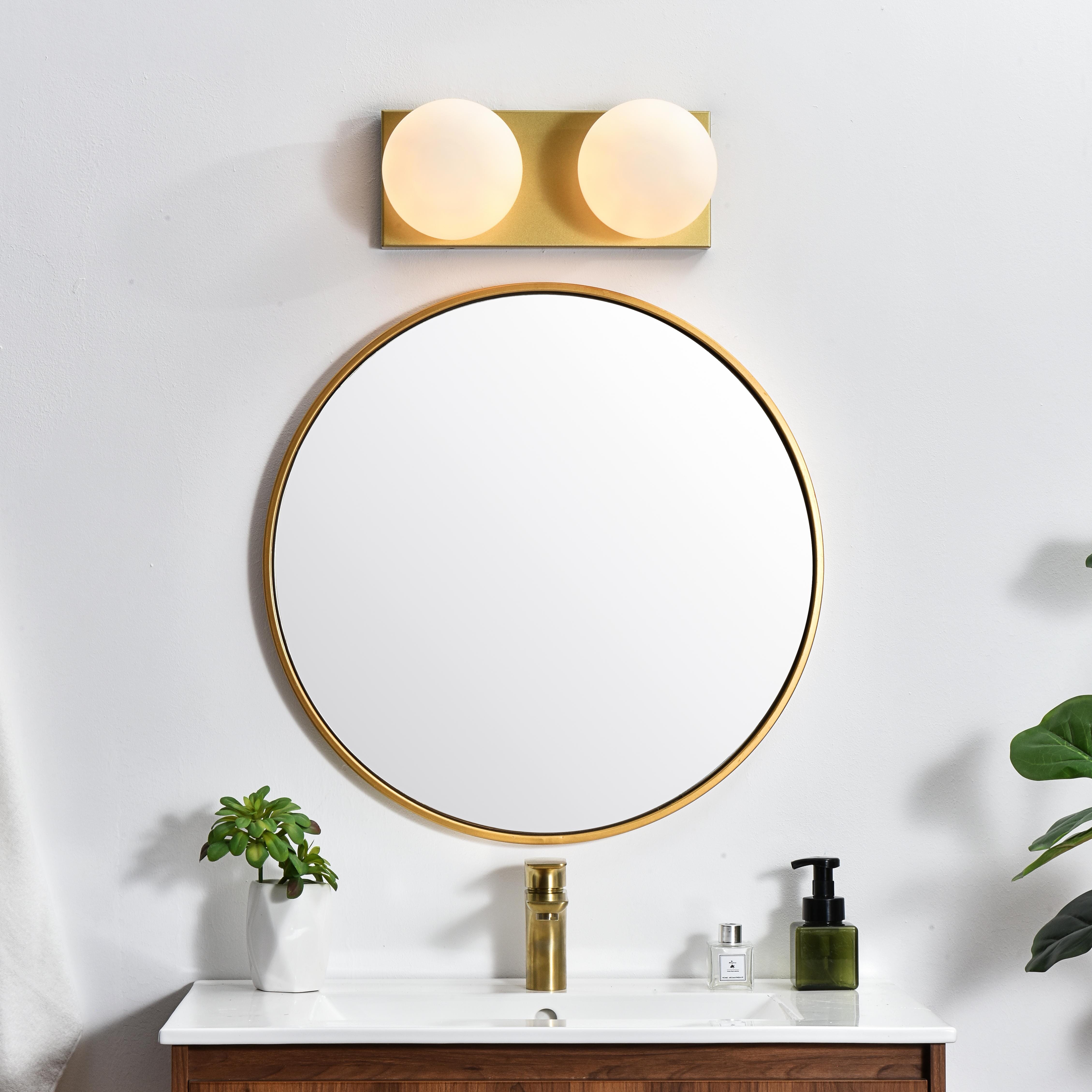 An art deco staple with a modern update in this stunning light bath rectangular base. Made of iron, this simple yet sophisticated design showcases a clean-cut rectangle backplate with an oversize frosted glass to balance the look. Rated for use in damp locations, this will work perfectly over a vanity using 40W bulbs ( not included). Compatible with dimmers, so you'll have the right amount of light in any given time of the day. Collection: Jaylin Rooms: Bathroom Finish: Brass and frosted white Glass: frosted white Width: 14.00" Height: 6.00" Weight: 4.00 lb Extension from Wall: 7.00" Wire: 8" Black and White Canopy: 14.2"x5.9"x1" Number of Bulbs: 2 Maximum Wattage: 40.00 W Bulb Type: E12 Bulb Base: E12 Dimmable Voltage: 110.00 V Material: Iron and Glass Country of Origin: China Safety Listing: ETL Safety Rating: Damp Title 20 Title 24 Manufacturer Warranty: 1 year limited - alternate view