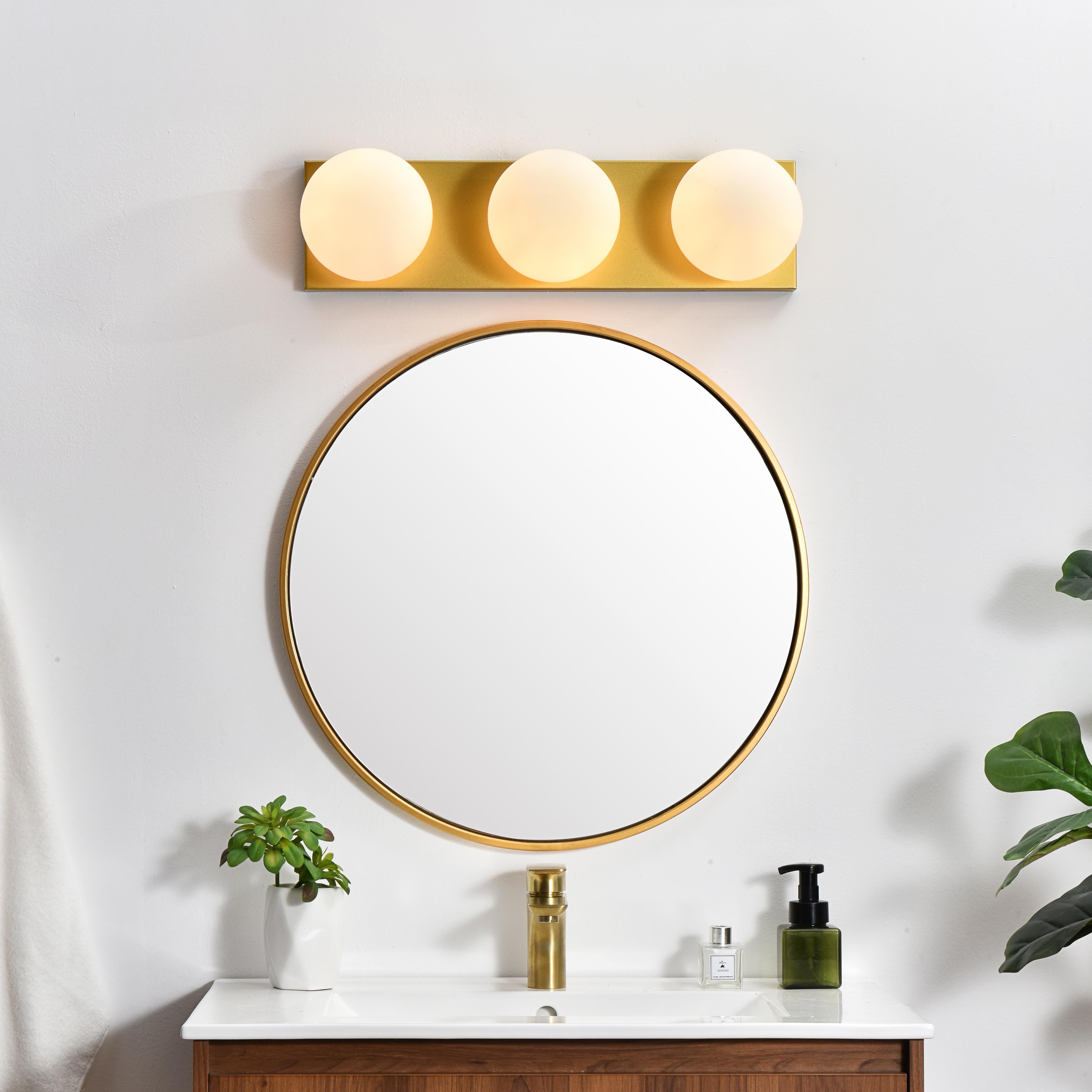 An art deco staple with a modern update in this stunning light bath rectangular base. Made of iron, this simple yet sophisticated design showcases a clean-cut rectangle backplate with an oversize frosted glass to balance the look. Rated for use in damp locations, this will work perfectly over a vanity using 40W bulbs ( not included). Compatible with dimmers, so you'll have the right amount of light in any given time of the day. Collection: Jaylin Rooms: Bathroom Finish: Brass and frosted white Glass: frosted white Width: 22.00" Height: 6.00" Weight: 5.00 lb Extension from Wall: 7.00" Wire: 8" Black and White Canopy: 22.4"x5.9"x1" Number of Bulbs: 3 Maximum Wattage: 40.00 W Bulb Type: E12 Bulb Base: E12 Dimmable Voltage: 110.00 V Material: Iron and Glass Country of Origin: China Safety Listing: ETL Safety Rating: Damp Title 20 Title 24 Manufacturer Warranty: 1 year limited - alternate view