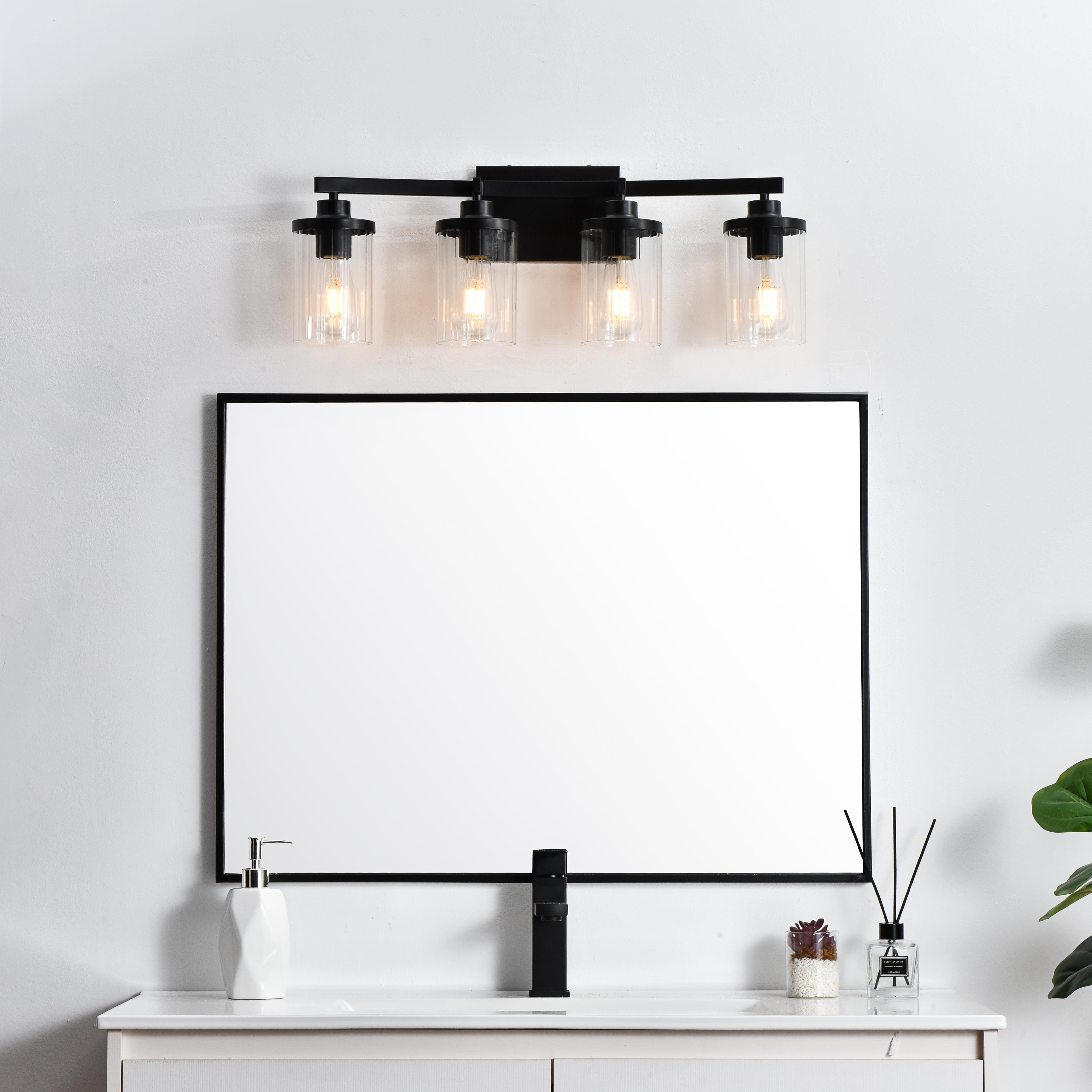 Specification Sheet
Dimensions
Length: 5.6"
Width: 25"
Height: 10"
Extension: 6"
Wire Length: 8"
Depth: 6"
Specifications
Assembly Required: Yes
Bulb Included: No
#N/A
Dimmable: Yes
Distressed Finish: No
Dry/Wet/Damp: Damp
ETL: yes
Finish (Color): Black and Clear
Fixture Material: Iron and Glass
Hardware Finish: Black
Harware Material: Iron
Max/Nominal Watt: 160W
Number of Lights: 4
Product Type: Vanity Lights
Product Warranty: 1 year limited
Socket Type: E26
Voltage: 110V
Wattage/Bulb: 40W
Weight: 5
Wire Included: Yes
Shipment type: Small Parcel
US Shipping Cost: $14.00 - alternate view