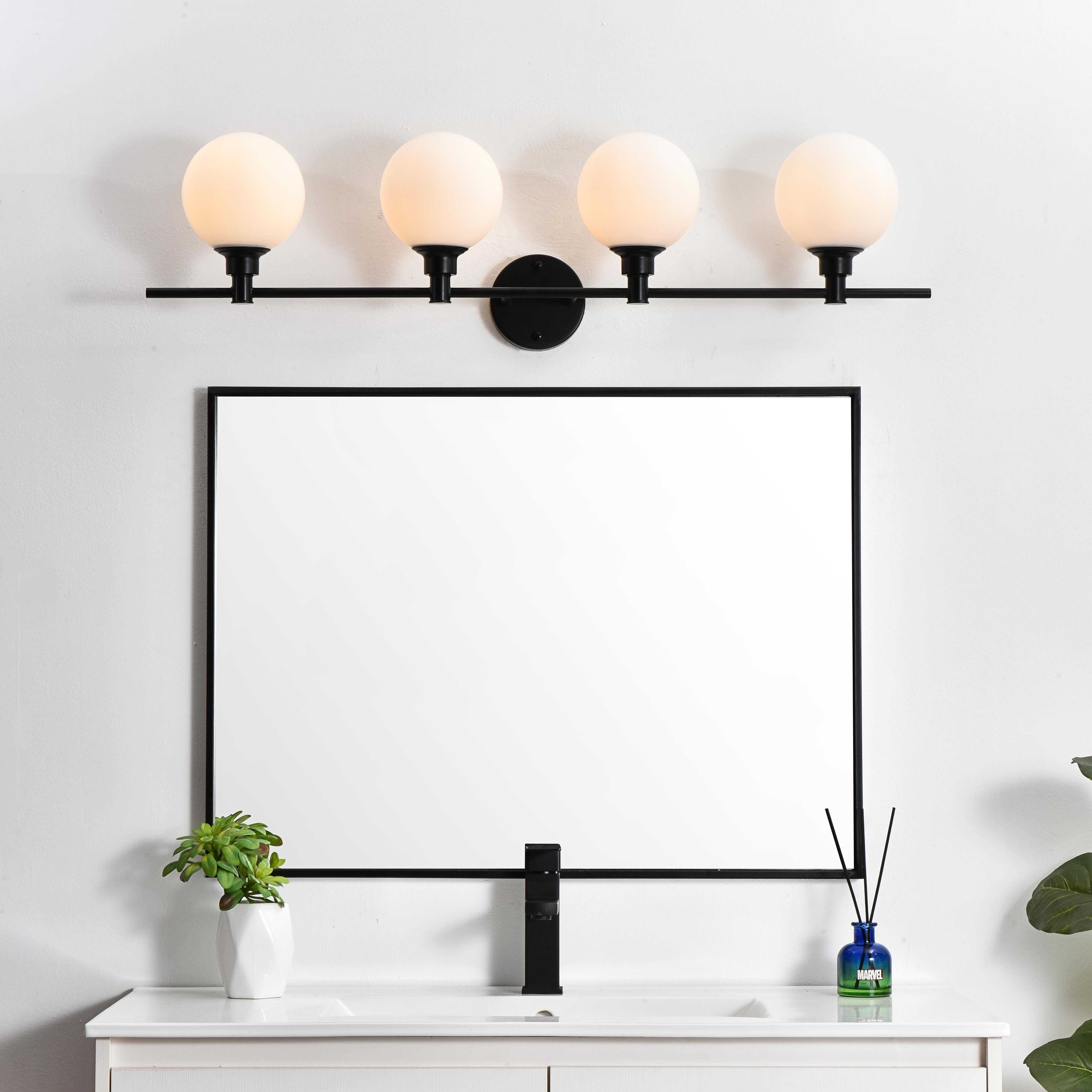 Specification Sheet
Dimensions
Length: 7.7"
Width: 38"
Height: 10"
Extension: 8"
Wire Length: 8"
Depth: 8"
Specifications
Assembly Required: Yes
Bulb Included: No
#N/A
Dimmable: Yes
Distressed Finish: No
Dry/Wet/Damp: Damp
ETL: yes
Finish (Color): Black and Frosted White
Fixture Material: Iron and Glass
Hardware Finish: Black
Harware Material: Iron
Max/Nominal Watt: 160W
Number of Lights: 4
Product Type: Vanity Lights
Product Warranty: 1 year limited
Socket Type: E12
Voltage: 110V
Wattage/Bulb: 40W
Weight: 6
Wire Included: Yes
Shipment type: Small Parcel
US Shipping Cost: $17.00 - alternate view