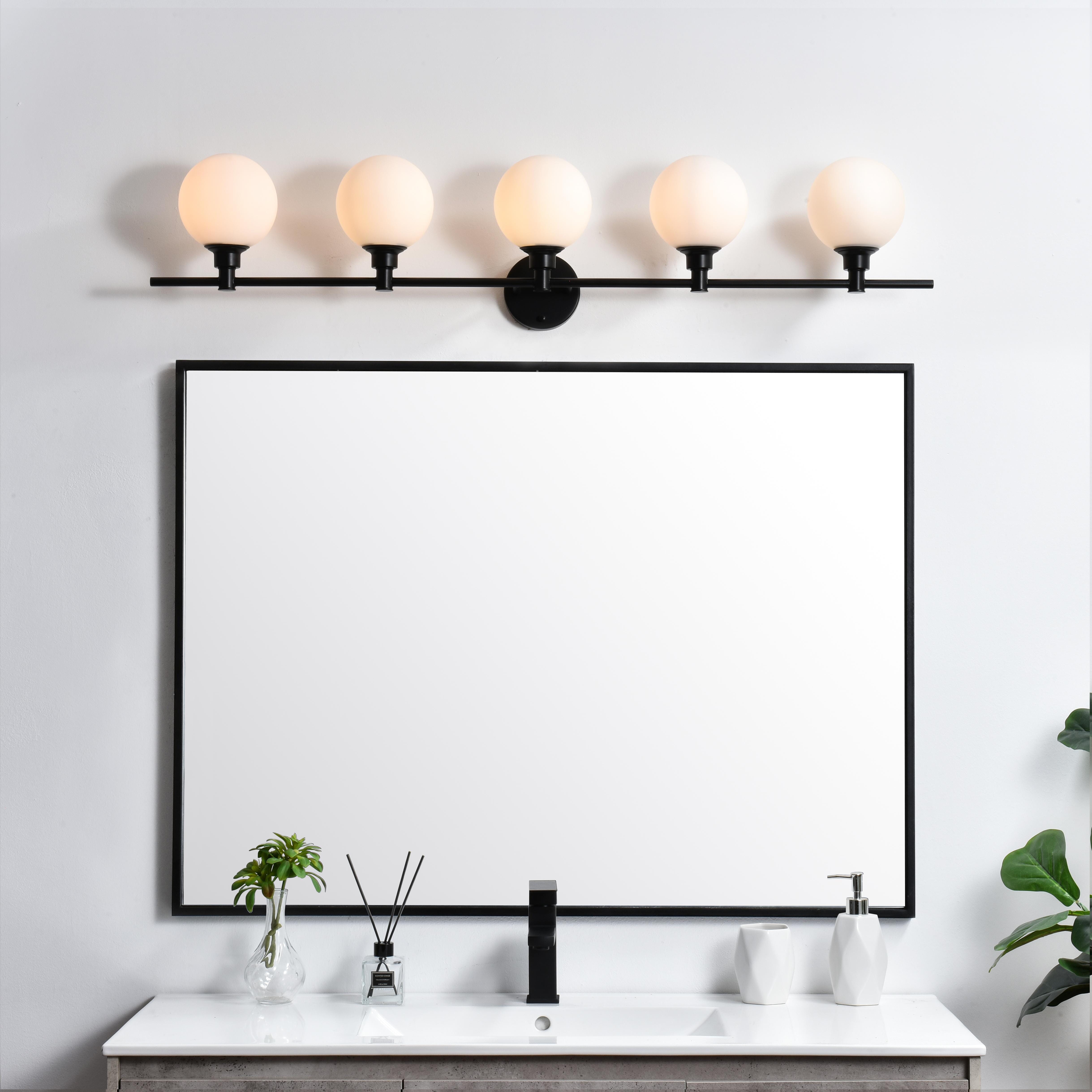 Specification Sheet
Dimensions
Length: 7.7"
Width: 47"
Height: 10"
Extension: 8"
Wire Length: 8"
Depth: 8"
Specifications
Assembly Required: Yes
Bulb Included: No
#N/A
Dimmable: Yes
Distressed Finish: No
Dry/Wet/Damp: Damp
ETL: yes
Finish (Color): Black and Frosted White
Fixture Material: Iron and Glass
Hardware Finish: Black
Harware Material: Iron
Max/Nominal Watt: 200W
Number of Lights: 5
Product Type: Vanity Lights
Product Warranty: 1 year limited
Socket Type: E12
Voltage: 110V
Wattage/Bulb: 40W
Weight: 8
Wire Included: Yes
Shipment type: Small Parcel
US Shipping Cost: $29.00 - alternate view
