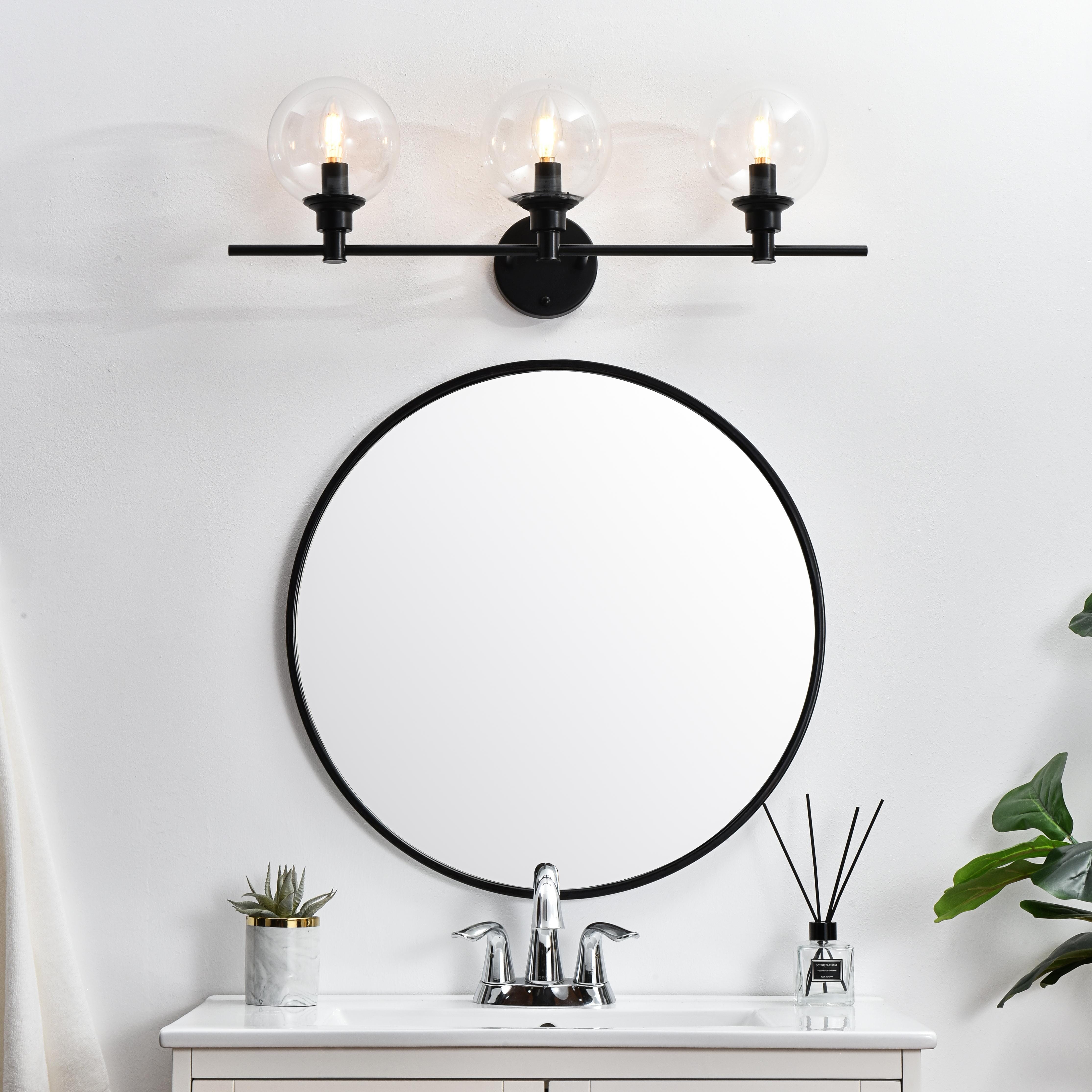 Specification Sheet
Dimensions
Length: 7.7"
Width: 28"
Height: 10"
Extension: 8"
Wire Length: 8"
Depth: 8"
Specifications
Assembly Required: Yes
Bulb Included: No
#N/A
Dimmable: Yes
Distressed Finish: No
Dry/Wet/Damp: Damp
ETL: yes
Finish (Color): Black and Clear
Fixture Material: Iron and Glass
Hardware Finish: Black
Harware Material: Iron
Max/Nominal Watt: 120W
Number of Lights: 3
Product Type: Vanity Lights
Product Warranty: 1 year limited
Socket Type: E12
Voltage: 110V
Wattage/Bulb: 40W
Weight: 5
Wire Included: Yes
Shipment type: Small Parcel
US Shipping Cost: $15.00 - alternate view