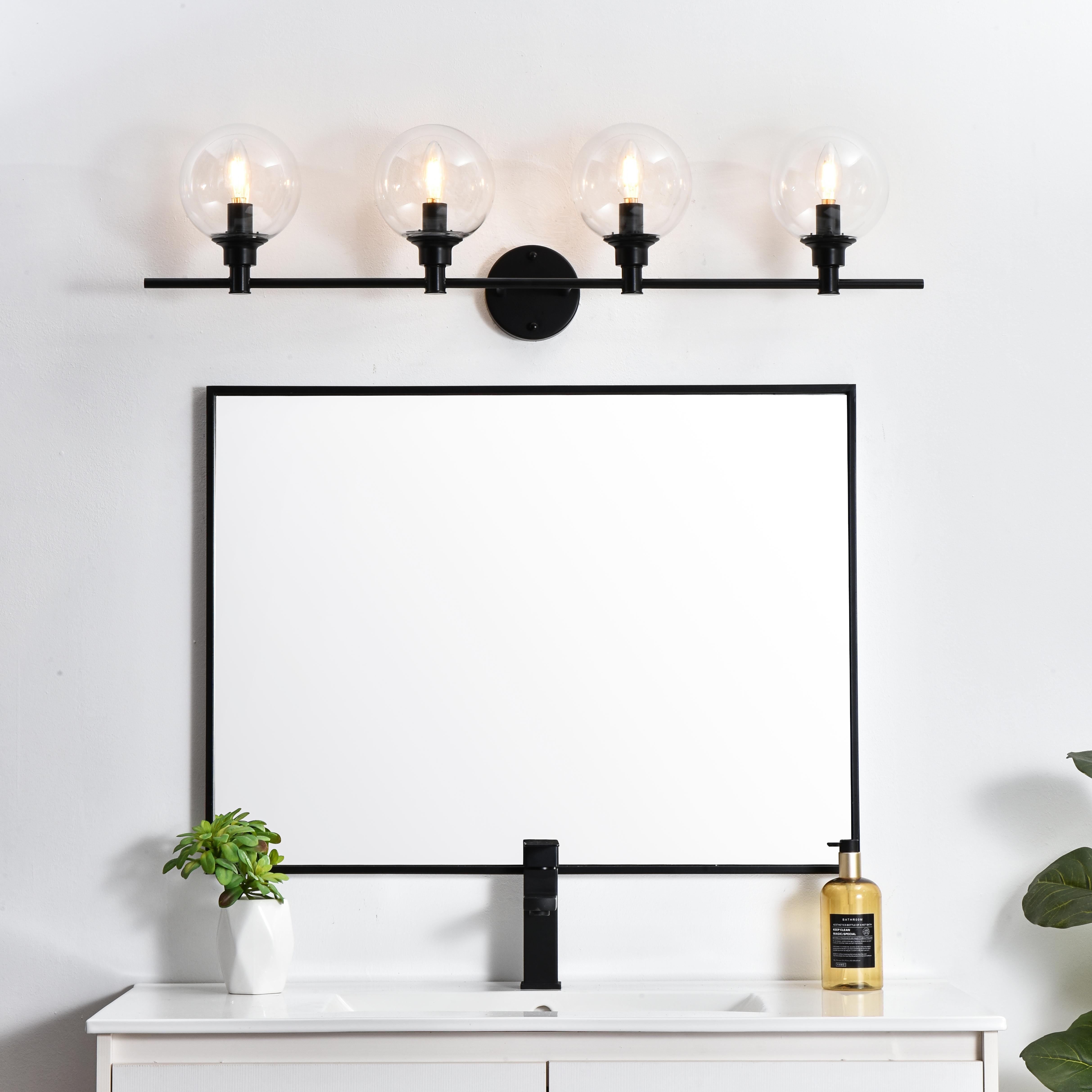 Specification Sheet
Dimensions
Length: 7.7"
Width: 38"
Height: 10"
Extension: 8"
Wire Length: 8"
Depth: 8"
Specifications
Assembly Required: Yes
Bulb Included: No
#N/A
Dimmable: Yes
Distressed Finish: No
Dry/Wet/Damp: Damp
ETL: yes
Finish (Color): Black and Clear
Fixture Material: Iron and Glass
Hardware Finish: Black
Harware Material: Iron
Max/Nominal Watt: 160W
Number of Lights: 4
Product Type: Vanity Lights
Product Warranty: 1 year limited
Socket Type: E12
Voltage: 110V
Wattage/Bulb: 40W
Weight: 6
Wire Included: Yes
Shipment type: Small Parcel
US Shipping Cost: $17.00 - alternate view