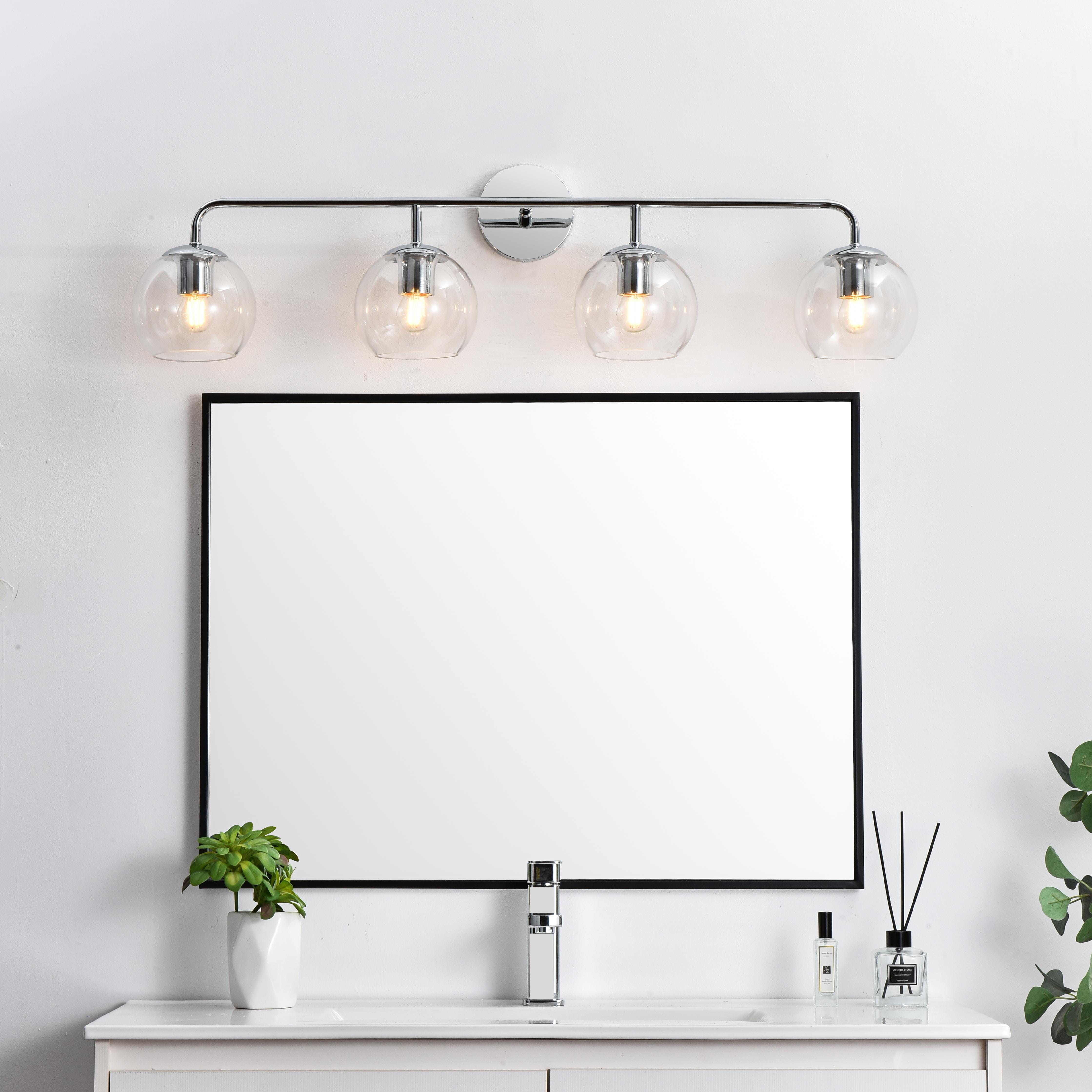 A modern twist on a traditional design, this vanity light is perfect for sprucing up your bathroom. Rated for use in damp locations, this iron fixture features a round backplate, curved arms, and orb accents. Completely versatile, you can place this wall light as an uplight or downlight. Rated for use in damp locations, this will work perfectly over a vanity in your bathroom. Collection: Genesis Rooms: Bathroom Finish: Chrome and Clear Glass: Clear Width: 37.00" Height: 10.00" Weight: 4.00 lb Extension from Wall: 8.00" Wire: 8" Black and White Canopy: 4.7"x1"x4.7" Number of Bulbs: 4 Maximum Wattage: 40.00 W Bulb Type: E26 Bulb Base: E26 Dimmable Voltage: 110.00 V Material: Iron and Glass Country of Origin: China Safety Listing: ETL Safety Rating: Damp Title 20 Title 24 Manufacturer Warranty: 1 year limited - alternate view