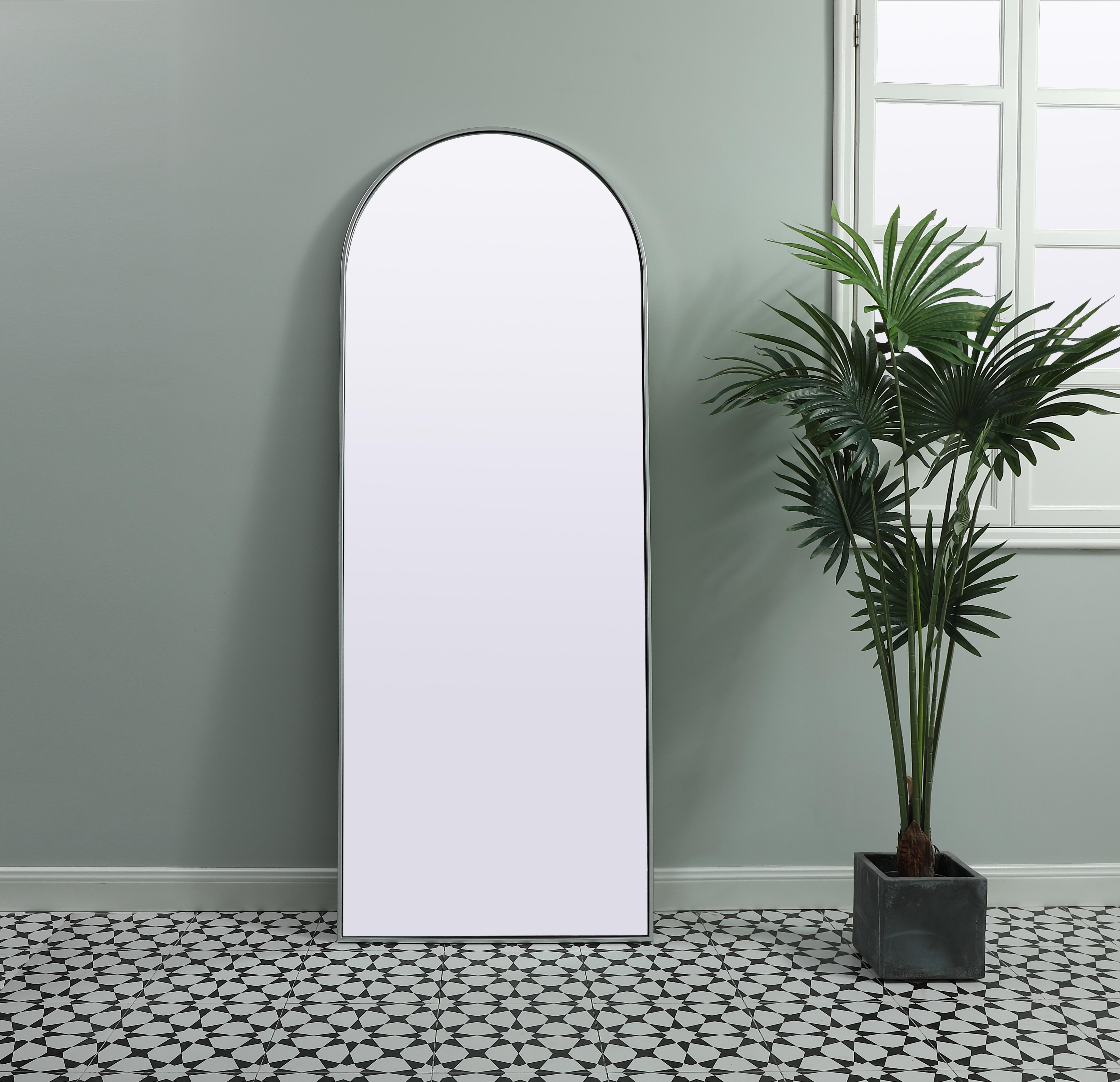Instantly open up any space in your home with this minimalist floor mounted mirror. Crafted of metal, this mirror strikes a round silhouette. Its slender, clean-lined frame sports a classic finish, while the glass mirror within features a flat, for a brilliant reflection, letting the light bounce off to expand your space. Designed in an arch shape, this metal-frame mirror showcases in the three available satin finishes in black, brass, or silver. Mount this work of art in any room of your choice or lean against the wall for added visual impact. Collection: Ayra Finish: Silver Width: 28.00" Height: 74.00" Length: 74.00" Weight: 38.00 lb Material: iron and MDF Country of Origin: China Manufacturer Warranty: 1 year limited - alternate view