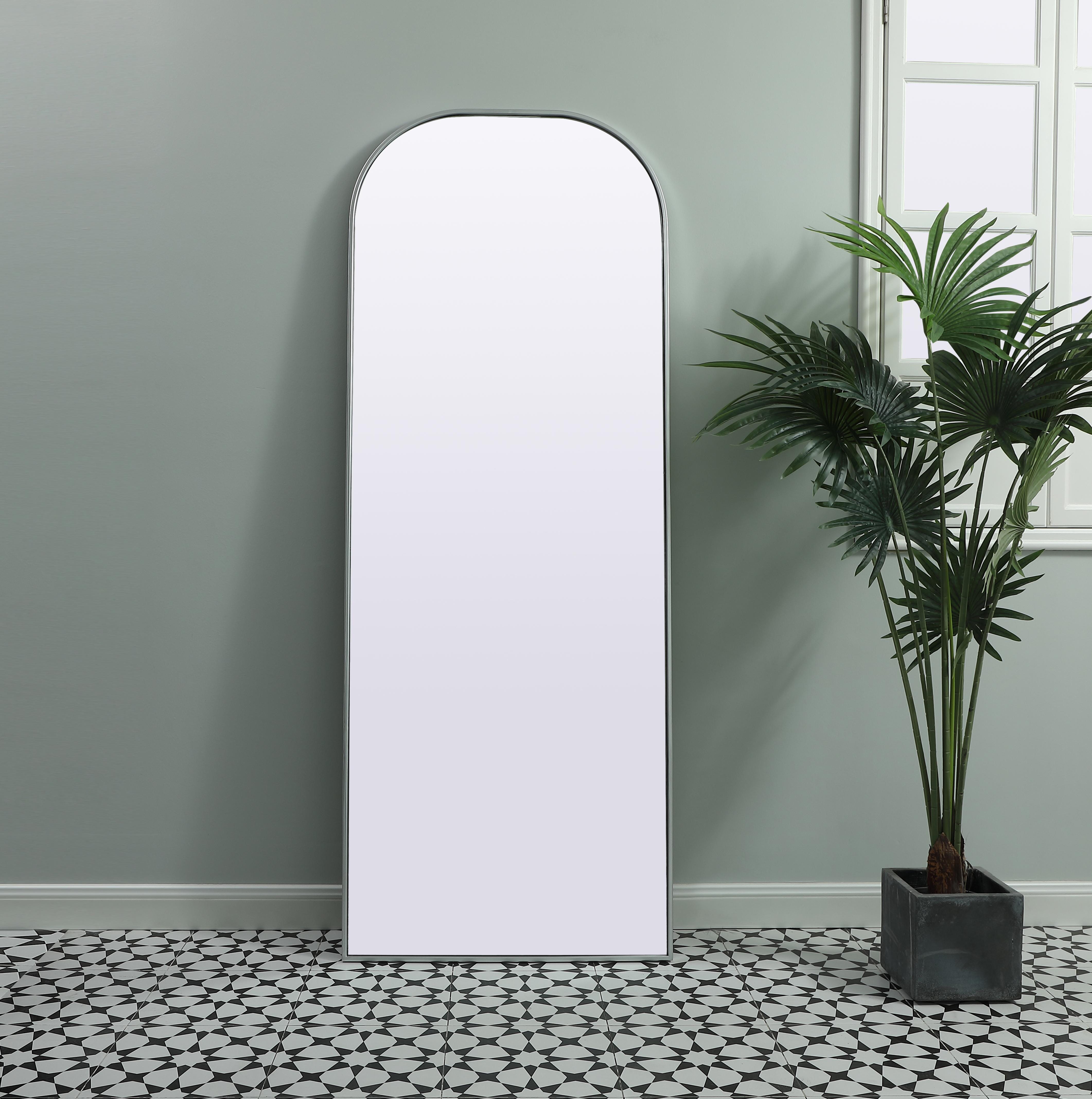 Over the mantel mirror serves an ideal décor on the mantel because it acts as an anchor piece that you can accentuate around with smaller accessories. The reflective qualities of the mirror can also make a space look bigger and brighter since it bounces light coming from your light sources. Designed with square bottom edges and rounded top, this mirror gives an unexpected twist to your typical mirror look. Select from three satin finishes in black, brass, or silver. Collection: Blaire Finish: Silver Width: 28.00" Height: 74.00" Length: 74.00" Weight: 38.00 lb Material: iron and MDF Country of Origin: China Manufacturer Warranty: 1 year limited - alternate view