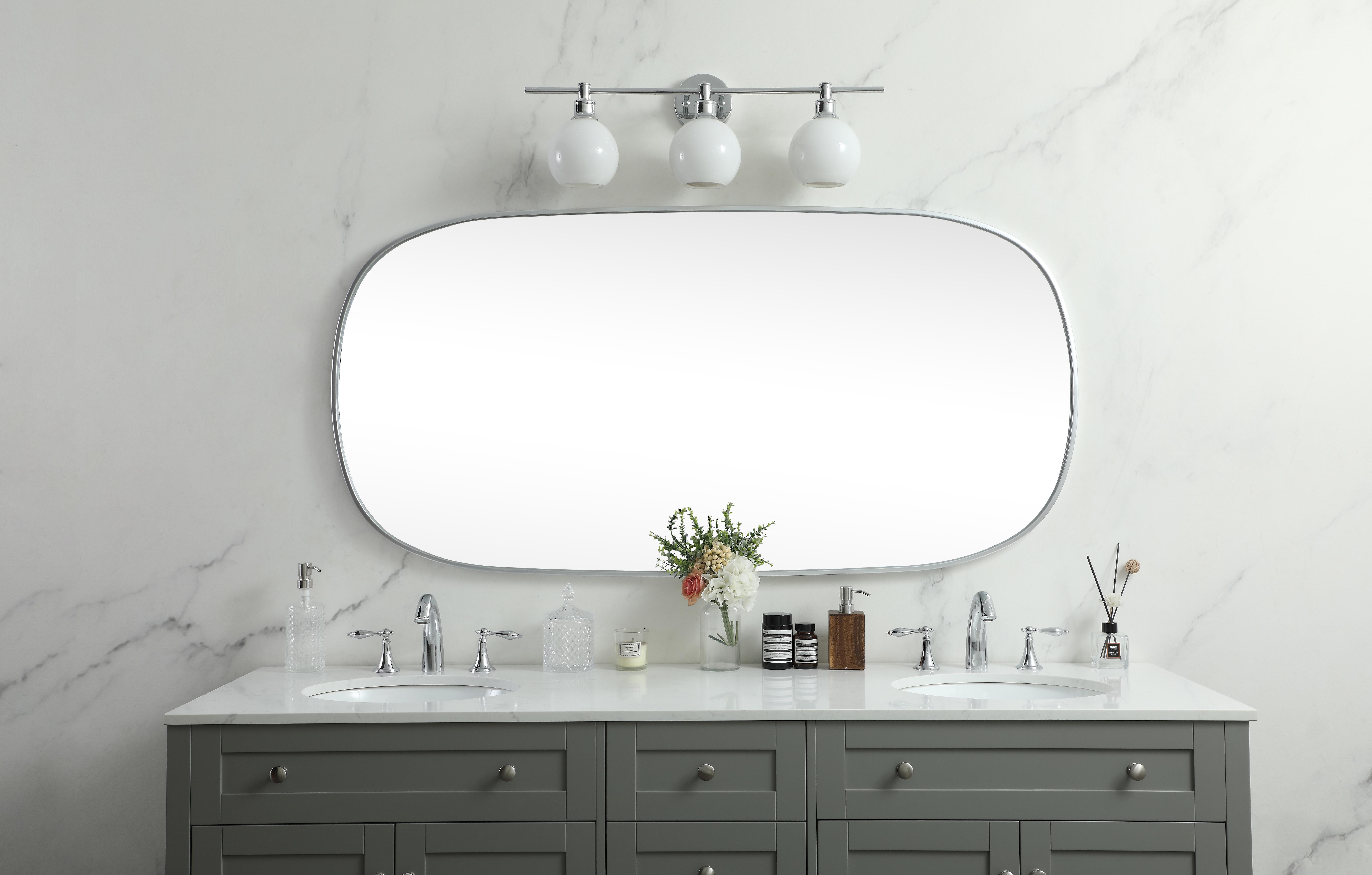 Crafted of metal, this mirror strikes a rounded corner silhouette. Instantly open up any space in your home with this minimalist wall-mounted mirror. Its slender, clean-lined frame sports a classic finish, while the glass mirror within features a flat, for a brilliant reflection, letting the light bounce off to expand your space. Designed in an oblong shape, this metal-frame mirror showcases in the three available satin finishes in black, brass, or silver. Mount this work of art in any room of your choice for added visual impact. Collection: Brynn Rooms: living room, entryway, bathroom, office Finish: Silver Width: 1.00" Height: 60.00" Length: 30.00" Weight: 31.00 lb Material: iron and MDF Country of Origin: China Manufacturer Warranty: 1 year limited - alternate view