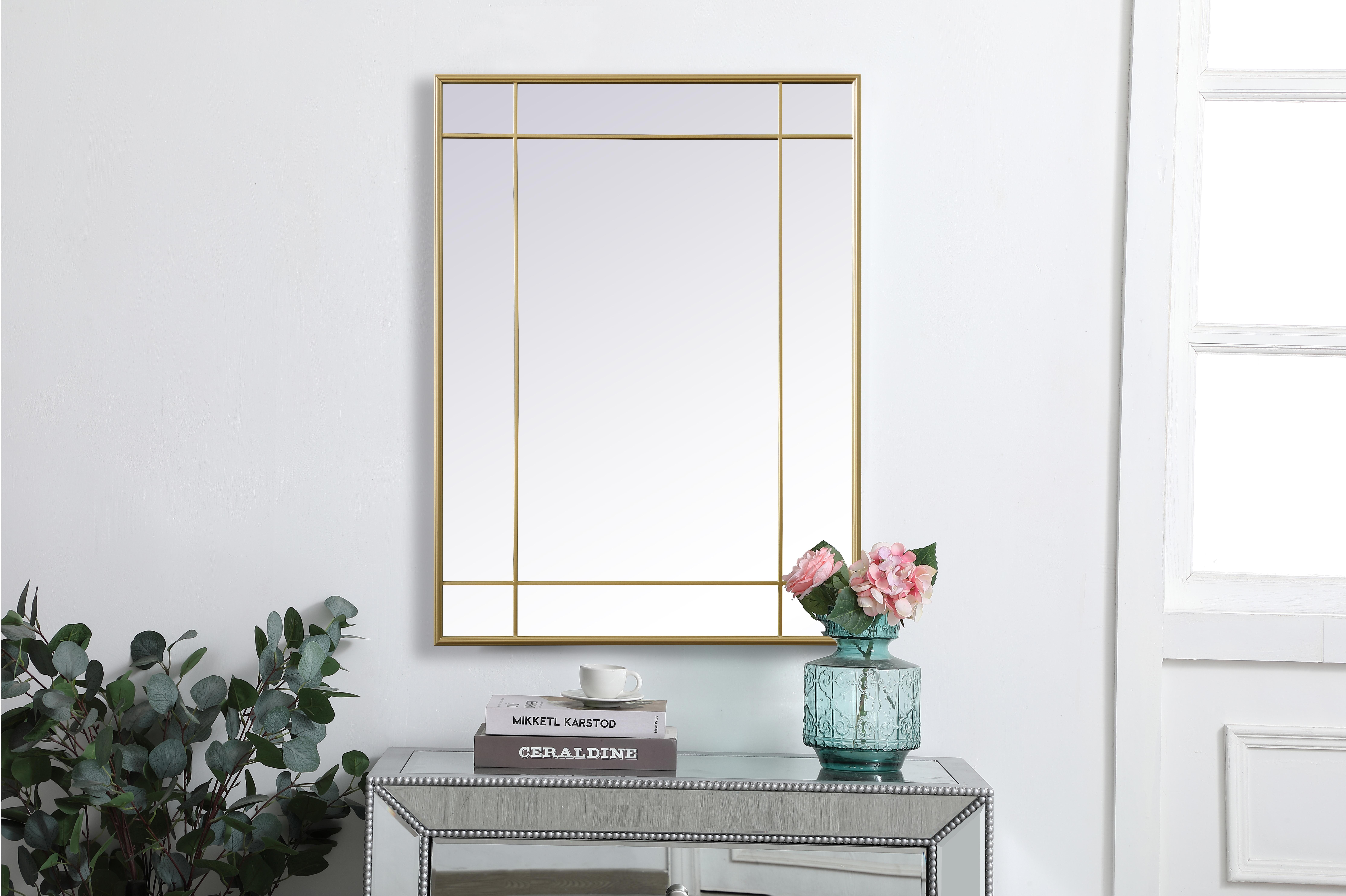 Our French panel mirror brings elegance to your living space with its timeless design, crafted from durable iron and high-quality glass. Its versatile hanging options allow you to place it horizontally or vertically, and the attached metal cleats simplify installation. Supported by a sturdy MDF backing, the mirror ensures stability, and its clear reflection without beveling makes it suitable for various settings. Beyond its decorative charm, it serves a practical purpose by enhancing natural light. With easy installation, this mirror is ideal for any room, adding a touch of charm and character. Its timeless aesthetic and clear, distortion-free vision make it a lasting and functional addition to your home. Collection: Viola Rooms: entry way, living room, dining room, bathroom, bedroom, office Finish: Brass Width: 40.00" Height: 1.00" Length: 30.00" Weight: 25.00 lb Material: Iron and MDF Country of Origin: China Manufacturer Warranty: 1 year limited - alternate view