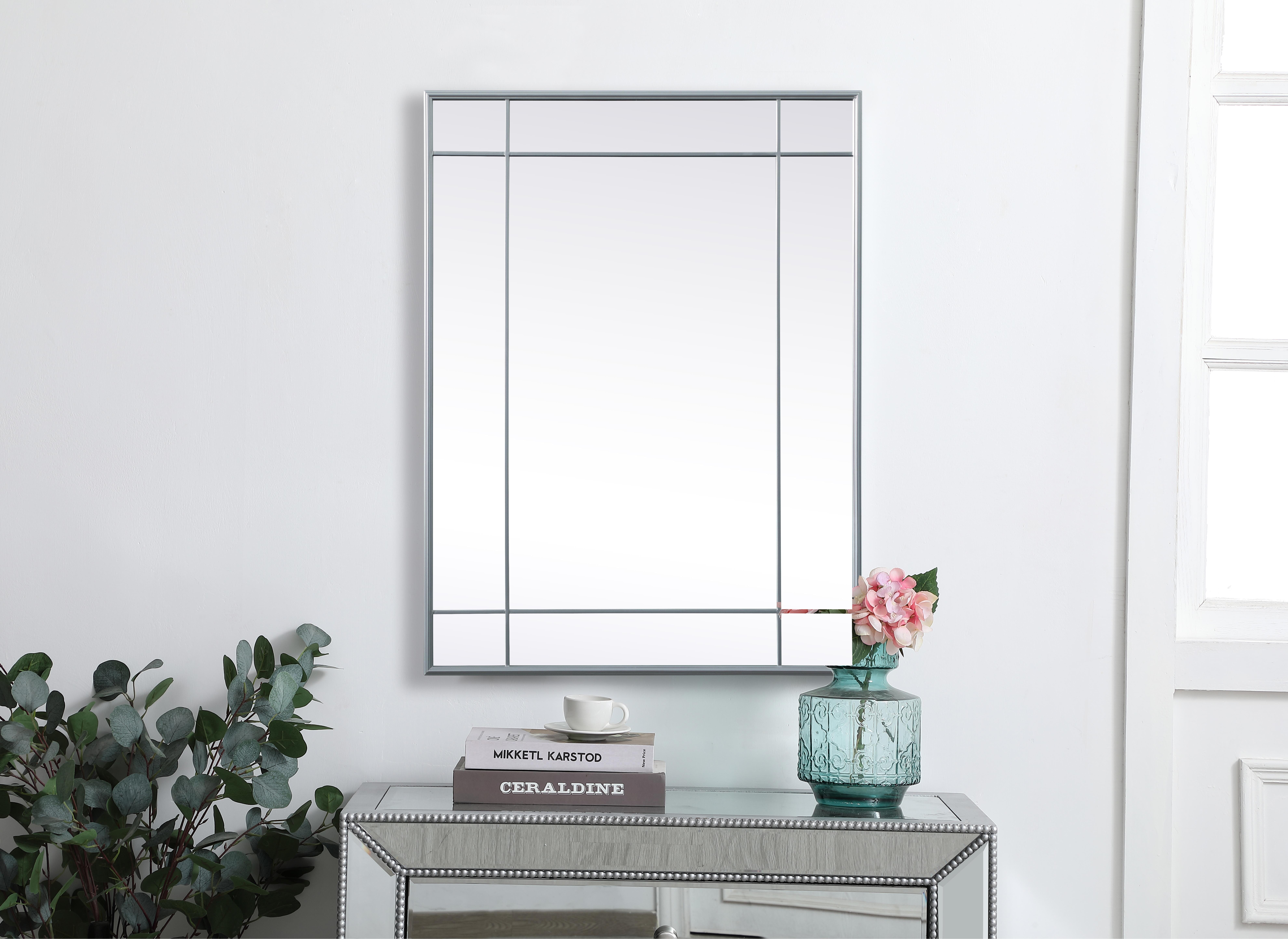 Our French panel mirror brings elegance to your living space with its timeless design, crafted from durable iron and high-quality glass. Its versatile hanging options allow you to place it horizontally or vertically, and the attached metal cleats simplify installation. Supported by a sturdy MDF backing, the mirror ensures stability, and its clear reflection without beveling makes it suitable for various settings. Beyond its decorative charm, it serves a practical purpose by enhancing natural light. With easy installation, this mirror is ideal for any room, adding a touch of charm and character. Its timeless aesthetic and clear, distortion-free vision make it a lasting and functional addition to your home. Collection: Viola Rooms: entry way, living room, dining room, bathroom, bedroom, office Finish: Silver Width: 40.00" Height: 1.00" Length: 30.00" Weight: 25.00 lb Material: Iron and MDF Country of Origin: China Manufacturer Warranty: 1 year limited - alternate view