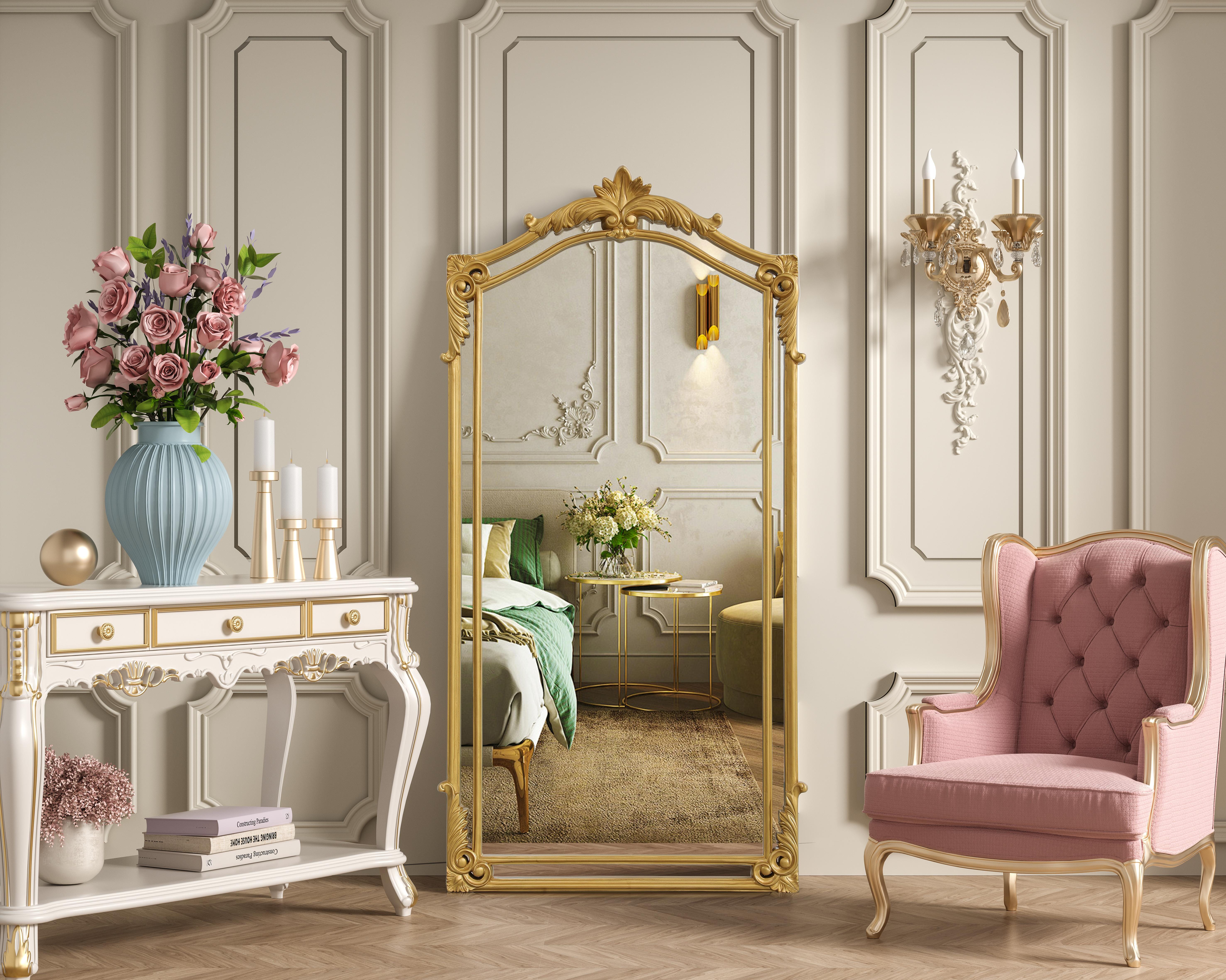 Bring the charm of a bygone era into your home with this ornate gold mirror, a true reflection of craftsmanship and timeless design. Featuring a hand-painted gold leaf finish, this mirror radiates warmth and sophistication, accentuating its intricate scrollwork and sculpted flourishes. Crafted from resin and MDF, the frame boasts ornamental detailing, reminiscent of European baroque and rococo influences. Designed for both practicality and artistry, this mirror comes with two inset metal hangers, making it easy to mount securely on any wall. Available in multiple sizes, it adapts effortlessly to different spaces—whether as a grand statement in an entryway, a luxurious focal point in a living room, or an ornate touch above a dressing table or fireplace. The gold leaf finish gives this mirror an antique-inspired glow, making it a perfect complement to traditional, vintage, and even eclectic interiors. Whether you're curating a Parisian-inspired bedroom or enhancing a classic hallway, this mirror brings a sense of grandeur and refinement to any setting. Collection: Madeline Rooms: Bathroom Finish: gold leaf Width: 33.50" Height: 66.00" Weight: 46.00 lb Extension from Wall: 2.40" Material: Resin and MDF Country of Origin: Vietnam Safety Rating: Dry Manufacturer Warranty: 1 year limited - alternate view