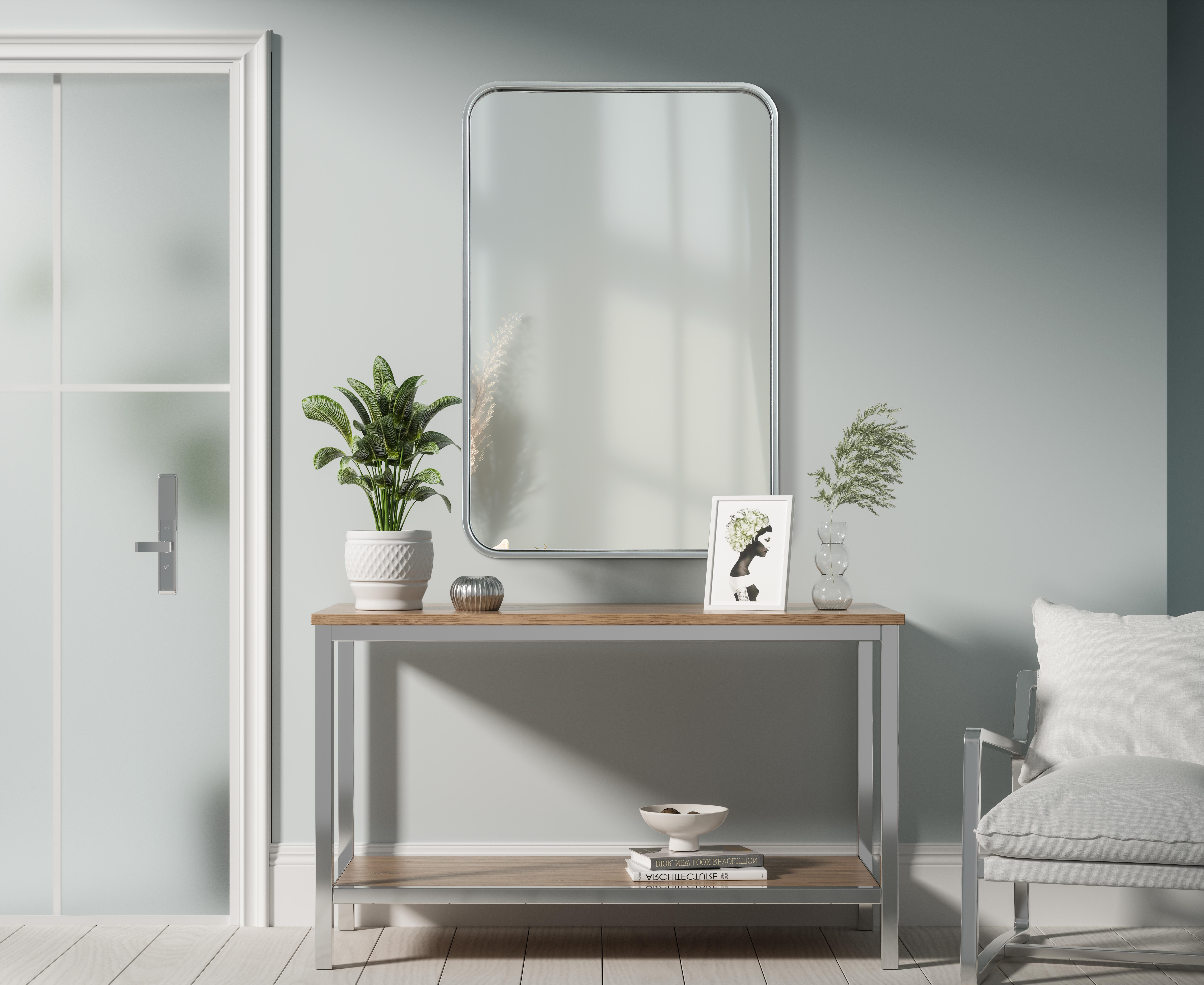 Elevate your home décor with this versatile wall mirror that combines functionality and modern design. Made from a sturdy combination of MDF, iron, and reflective mirror glass, this piece is built to last while adding a polished finish to any room. The extended depth of the frame not only provides a striking dimensional effect but also ensures the mirror's presence commands attention as a focal point. Whether you're decorating a bedroom, bathroom, or entryway, its diverse shapes—including rectangle and square—offer plenty of options to suit your style. The hand-painted black, brass, or silver finish brings a subtle yet striking touch, complemented by rounded corners for a smooth and contemporary aesthetic. With four metal inset hangers, it's ready to hang vertically or horizontally, ensuring flexibility for any layout. Available in multiple sizes, this mirror is a statement piece that blends seamlessly into both modern and classic spaces. Collection: Remy Rooms: Hallway, Living room, Bedroom, Entry Way, Office Finish: Silver Width: 20.00" Height: 30.00" Weight: 16.00 lb Extension from Wall: 2.00" Material: Iron and MDF Country of Origin: China Manufacturer Warranty: 1 year limited - alternate view