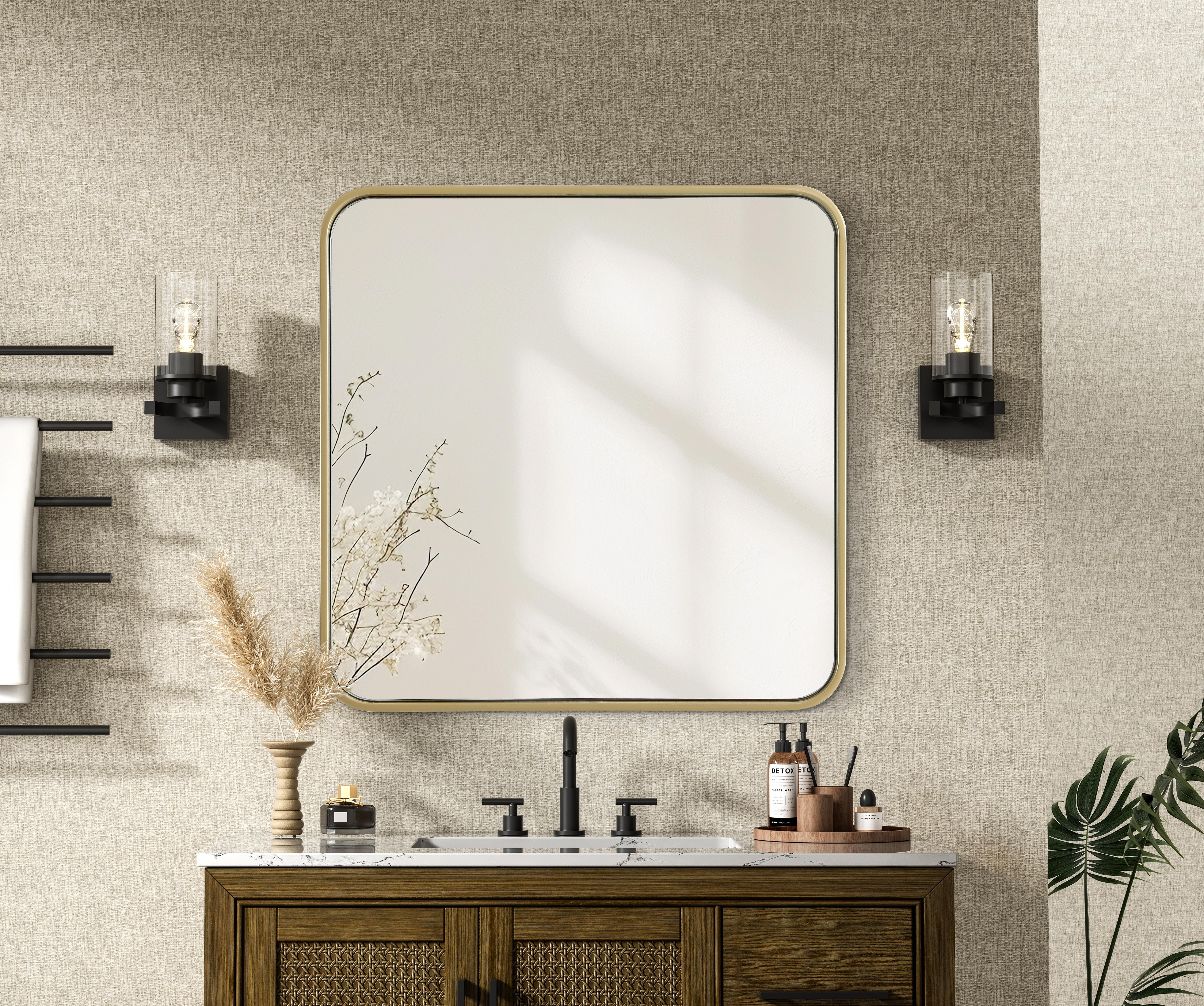 Elevate your home décor with this versatile wall mirror that combines functionality and modern design. Made from a sturdy combination of MDF, iron, and reflective mirror glass, this piece is built to last while adding a polished finish to any room. The extended depth of the frame not only provides a striking dimensional effect but also ensures the mirror's presence commands attention as a focal point. Whether you're decorating a bedroom, bathroom, or entryway, its diverse shapes—including rectangle and square—offer plenty of options to suit your style. The hand-painted black, brass, or silver finish brings a subtle yet striking touch, complemented by rounded corners for a smooth and contemporary aesthetic. With four metal inset hangers, it's ready to hang vertically or horizontally, ensuring flexibility for any layout. Available in multiple sizes, this mirror is a statement piece that blends seamlessly into both modern and classic spaces. Collection: Remy Rooms: Hallway, Living room, Bedroom, Entry Way, Office Finish: Brass Width: 24.00" Height: 24.00" Weight: 15.00 lb Extension from Wall: 2.00" Material: Iron and MDF Country of Origin: China Manufacturer Warranty: 1 year limited - alternate view