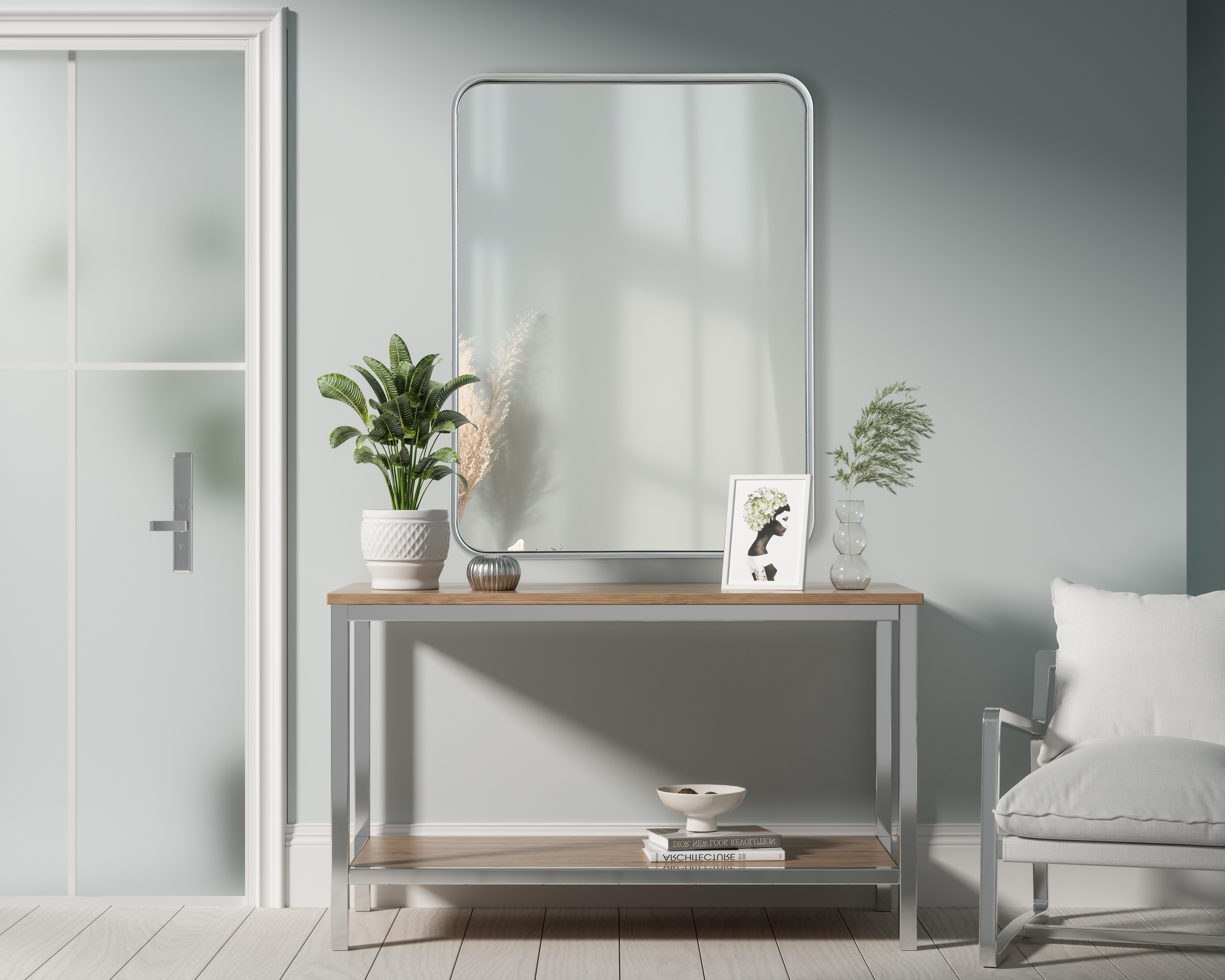 Elevate your home décor with this versatile wall mirror that combines functionality and modern design. Made from a sturdy combination of MDF, iron, and reflective mirror glass, this piece is built to last while adding a polished finish to any room. The extended depth of the frame not only provides a striking dimensional effect but also ensures the mirror's presence commands attention as a focal point. Whether you're decorating a bedroom, bathroom, or entryway, its diverse shapes—including rectangle and square—offer plenty of options to suit your style. The hand-painted black, brass, or silver finish brings a subtle yet striking touch, complemented by rounded corners for a smooth and contemporary aesthetic. With four metal inset hangers, it's ready to hang vertically or horizontally, ensuring flexibility for any layout. Available in multiple sizes, this mirror is a statement piece that blends seamlessly into both modern and classic spaces. Collection: Remy Rooms: Hallway, Living room, Bedroom, Entry Way, Office Finish: Silver Width: 24.00" Height: 32.00" Weight: 19.00 lb Extension from Wall: 2.00" Material: Iron and MDF Country of Origin: China Manufacturer Warranty: 1 year limited - alternate view