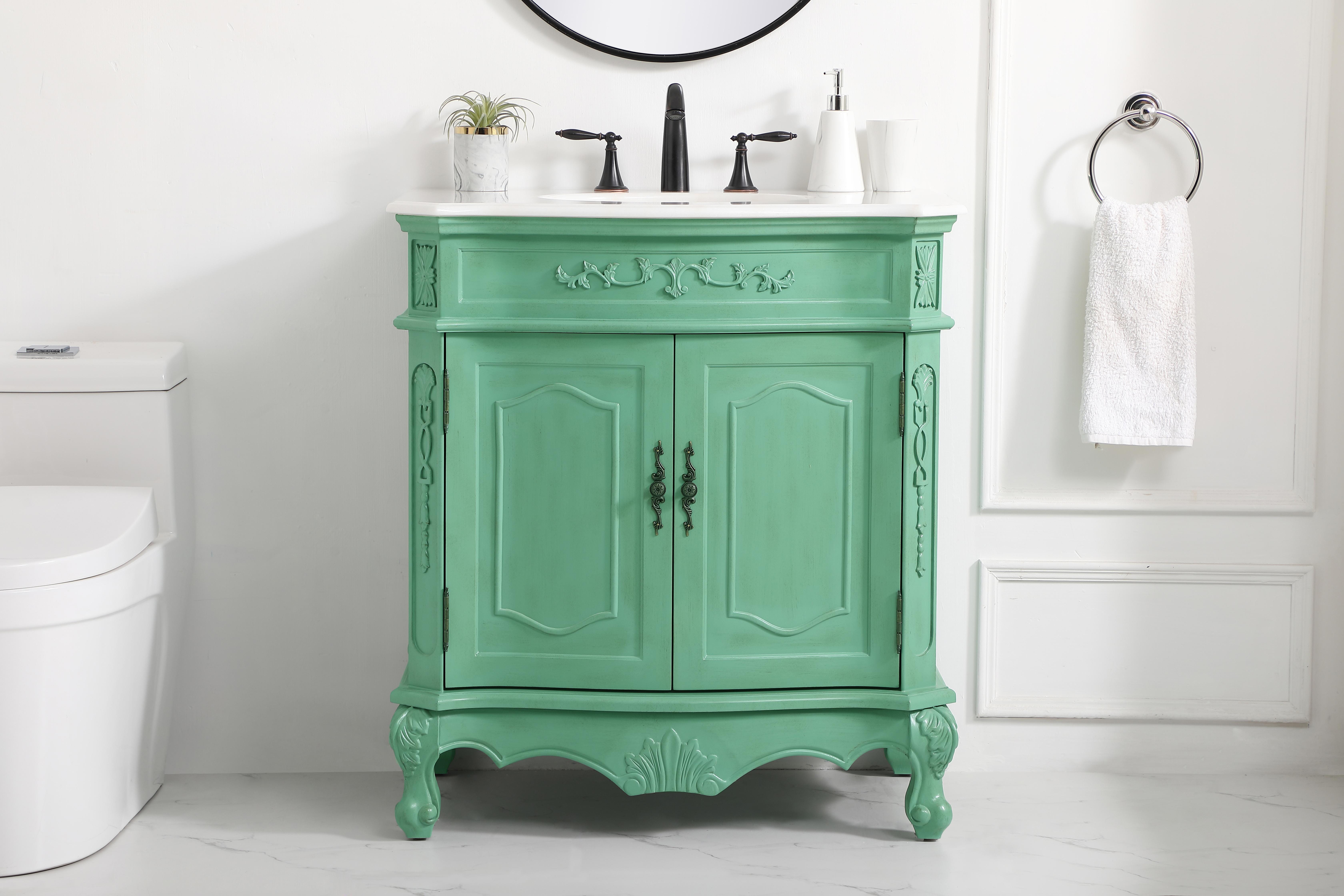 Dimensions
Length: 32"
Width: 21"
Height: 36"
Counter Top Length: 32"
Counter Top Width: 21"
Counter Top Height: 0.75"
Sink Width: 16"
Sink Depth: 13"
Sink Height: 7"
Sink Drain Hole Size: 1.75"
Faucet Hole Spacing: 8"3 Holes"
Specifications
Assembly Required: no
Base Material: Solid wood and MDF
Counter Top Edge Style: Ogee
Counter Top Finish: Ivory white
Distressed Finish: Yes
Finish (Color): Vintage Mint
Fixture Material: Solid Wood and MDF
Hardware Finish: Antique bronze
Harware Material: Aluminum alloy
Number of Faucet Holes: 3
Number of Sinks: 1
Product Shape: Rectangle
Product Type: Bathroom Vanities
Product Warranty: 1 year limited
Sink Mounting Type: Undermount
Vanity Backsplash: NO
Vanity Mounting Type: Free-Standing
Weight: 106
Wire Included: No
Wood Type: birch
Shipment type: LTL
US Shipping Cost: $142.00
Shelves
Number of Shelves: 1
Shelf Width: 25.5
Cabinets
Number of Cabinets: 1
Cabinet Interior Width: 25.5
Cabinet Interior Depth: 17
Cabinet Interior Height: 19.75 - alternate view