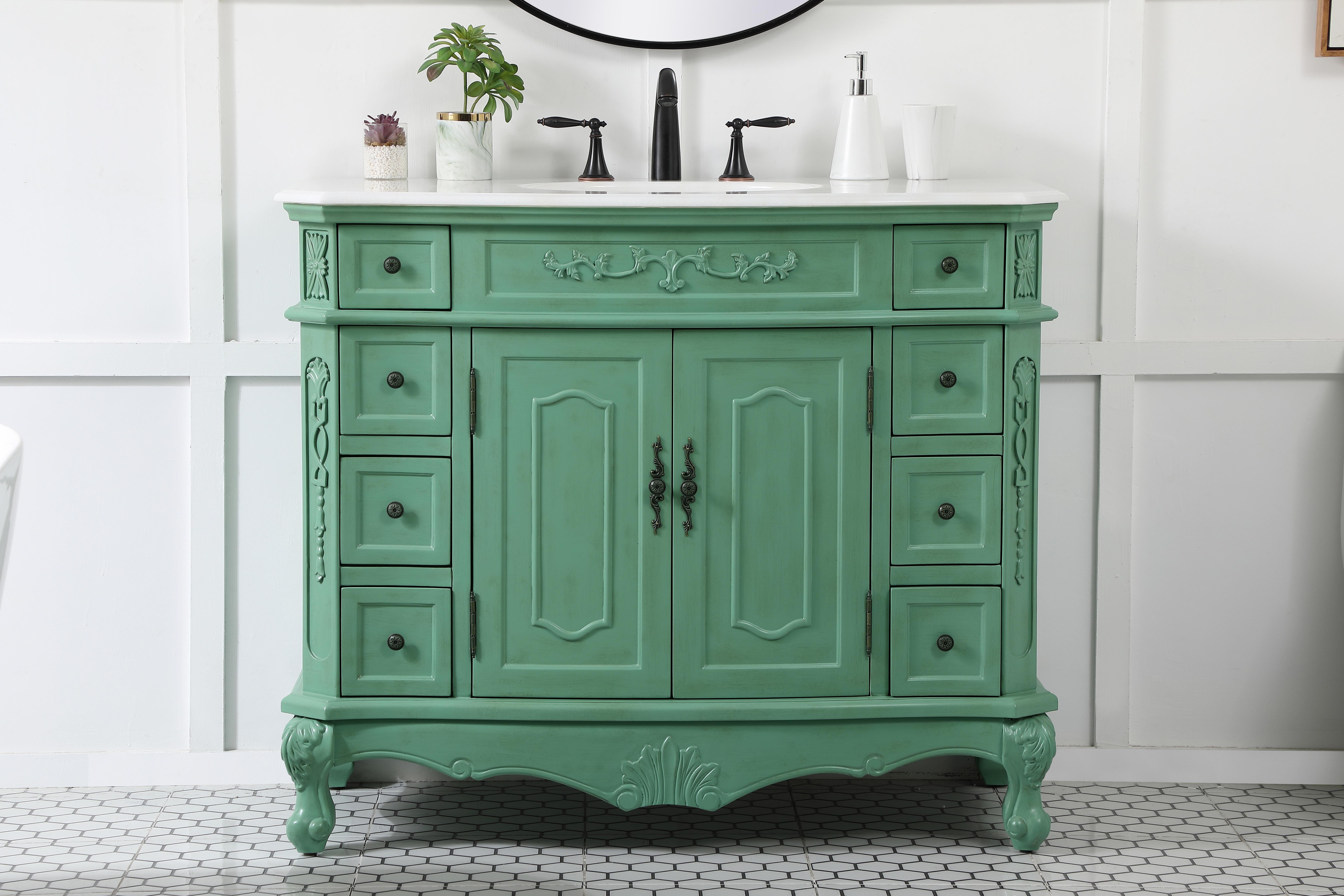 Dimensions
Length: 42"
Width: 21"
Height: 36"
Counter Top Length: 42"
Counter Top Width: 21"
Counter Top Height: 0.75"
Sink Width: 16"
Sink Depth: 13"
Sink Height: 7"
Sink Drain Hole Size: 1.75"
Faucet Hole Spacing: 8"3 Holes"
Specifications
Assembly Required: no
Base Material: Solid wood and MDF
Counter Top Edge Style: Ogee
Counter Top Finish: Ivory white
Distressed Finish: Yes
Finish (Color): Vintage Mint
Fixture Material: Solid Wood and MDF
Hardware Finish: Antique bronze
Harware Material: Aluminum alloy
Number of Faucet Holes: 3
Number of Sinks: 1
Product Shape: Rectangle
Product Type: Bathroom Vanities
Product Warranty: 1 year limited
Sink Mounting Type: Undermount
Vanity Backsplash: NO
Vanity Mounting Type: Free-Standing
Weight: 158
Wire Included: No
Wood Type: birch
Shipment type: LTL
US Shipping Cost: $182.00
Drawers
Drawers Included: yes
Number of Drawers: 8
Drawer Width: DW1:6
DW2:6
Drawer Depth: DW1:16
DW2:16
Drawer Height: DW1:6
DW2:4.5
Drawer Handle Designs: knobs
Shelves
Number of Shelves: 1
Shelf Width: 22
Cabinets
Number of Cabinets: 1
Cabinet Interior Width: 22
Cabinet Interior Depth: 17
Cabinet Interior Height: 19.75 - alternate view
