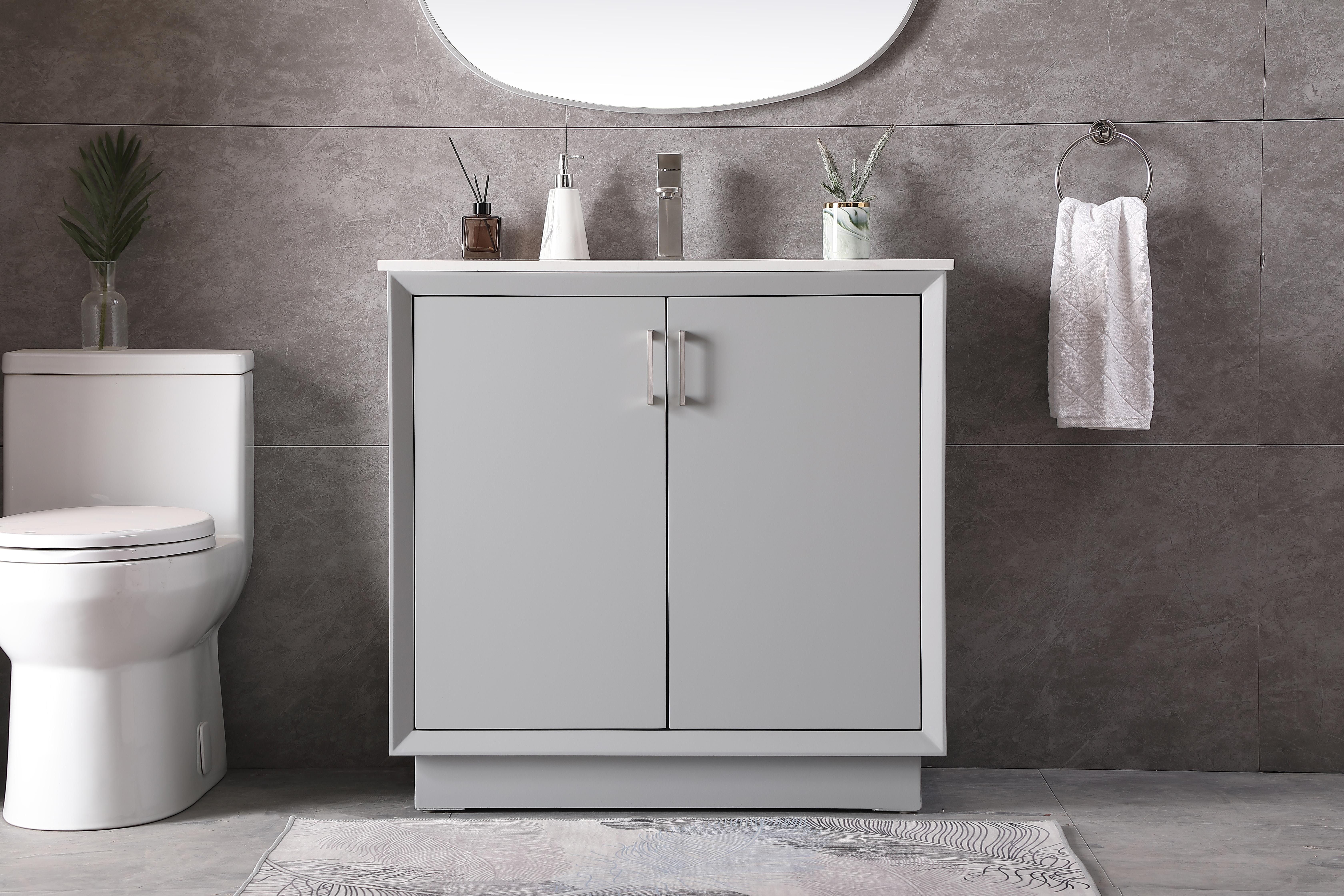 A sleek 36-inch bathroom vanity combining contemporary boxy design with practical storage. Features engineered marble countertop, undermount porcelain sink, soft-closing doors with bar pulls, and solid wood legs for stability. - alternate view