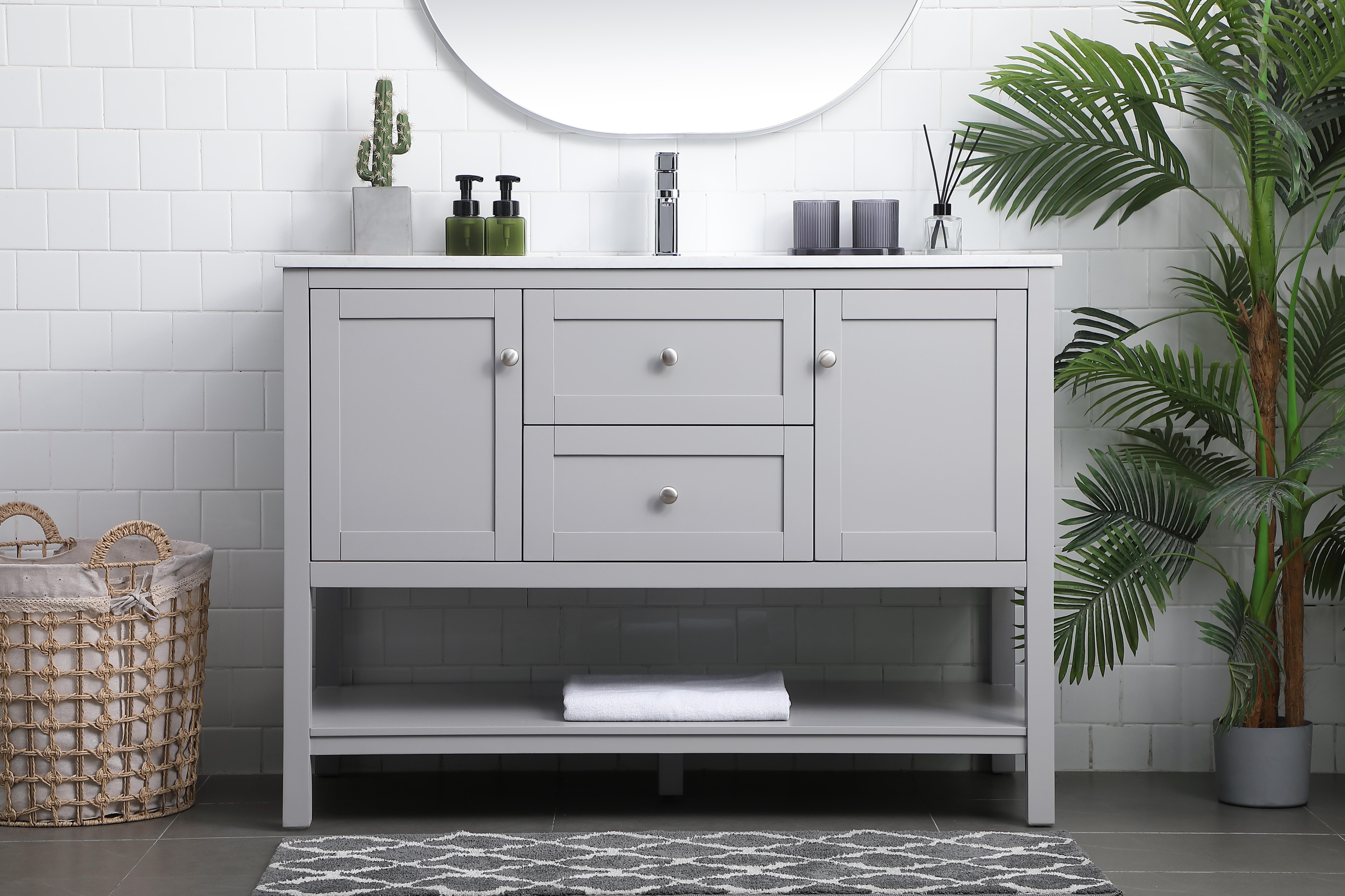 Dimensions
Length: 48"
Width: 21.5"
Height: 35"
Counter Top Length: 48"
Counter Top Width: 21.5"
Counter Top Height: 0.7"
Sink Width: 15.8"
Sink Depth: 10.9"
Sink Height: 7.875"
Sink Drain Hole Size: 1.77"
Faucet Hole Spacing: 1 Hole"
Specifications
Assembly Required: NO
Base Material: MDF
Counter Top Edge Style: Straight
Counter Top Finish: Calacatta white
Distressed Finish: NO
Drain Assembly Included: NO
Faucet Included: NO
Finish (Color): Grey
Vanity Material: Solid Wood and MDF
Hardware Finish: Brushed nickel
Harware Material: Aluminium alloy
Number of Faucet Holes: 1
Number of Sinks: 1
Product Shape: Rectangle
Product Type: Bathroom Vanities
Product Warranty: 1 year limited
Sink Mounting Type: Undermount
Vanity Backsplash: NO
Vanity Mounting Type: Free-Standing
Weight: 159
Wire Included: No
Wood Type: Rubberwood
Shipment type: LTL
US Shipping Cost: $213.00
Drawers
Drawers Included: Yes
Number of Drawers: 1
False Drawers: YES
Drawer Width: 17.625
Drawer Depth: 14
Drawer Height: 8.25
Drawer Handle Designs: Knob
Shelves
Number of Shelves: 1
Shelf Width: 43.625
17.5
Cabinets
Number of Cabinets: 2
Cabinet Interior Width: 12.75
Cabinet Interior Depth: 17.5
Cabinet Interior Height: 16.875 - alternate view