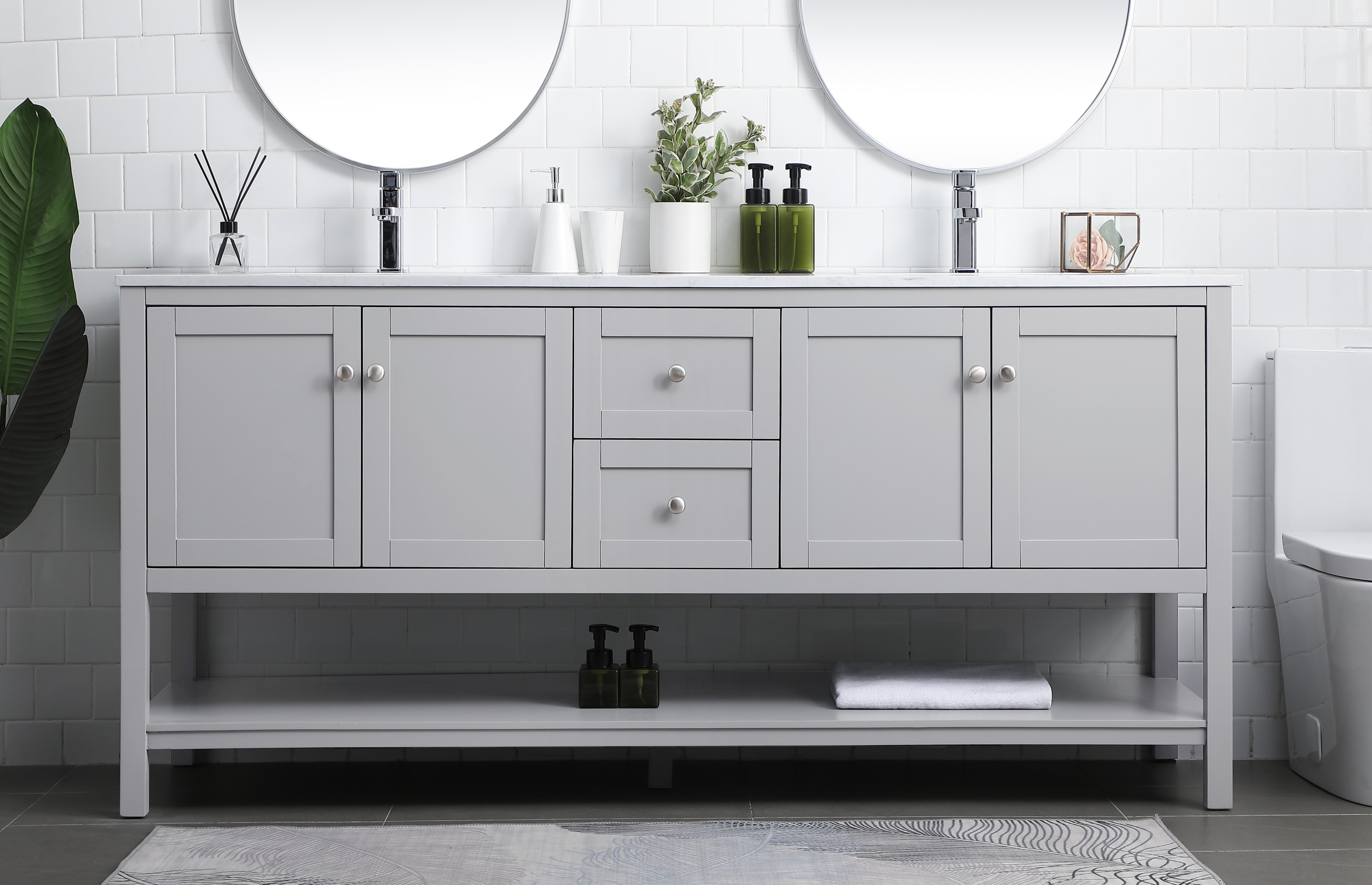 Dimensions
Length: 72"
Width: 21.5"
Height: 35"
Counter Top Length: 72"
Counter Top Width: 21.5"
Counter Top Height: 0.7"
Sink Width: 15.8"
Sink Depth: 10.9"
Sink Height: 7.875"
Sink Drain Hole Size: 1.77"
Faucet Hole Spacing: 1 Hole"
Specifications
Assembly Required: NO
Base Material: MDF
Counter Top Edge Style: Straight
Counter Top Finish: Calacatta white
Distressed Finish: NO
Drain Assembly Included: NO
Faucet Included: NO
Finish (Color): Grey
Vanity Material: Solid Wood and MDF
Hardware Finish: Brushed nickel
Harware Material: Aluminium alloy
Number of Faucet Holes: 2
Number of Sinks: 2
Product Shape: Rectangle
Product Type: Bathroom Vanities
Product Warranty: 1 year limited
Sink Mounting Type: Undermount
Vanity Backsplash: NO
Vanity Mounting Type: Free-Standing
Weight: 220
Wire Included: No
Wood Type: Rubberwood
Shipment type: LTL
US Shipping Cost: $309.00
Drawers
Drawers Included: Yes
Number of Drawers: 2
False Drawers: NO
Drawer Width: 13.375
Drawer Depth: 14
Drawer Height: 8.25
Drawer Handle Designs: Knob
Shelves
Number of Shelves: 1
Shelf Width: 67.625
17.5
Cabinets
Number of Cabinets: 2
Cabinet Interior Width: 27
Cabinet Interior Depth: 17.5
Cabinet Interior Height: 16.875 - alternate view