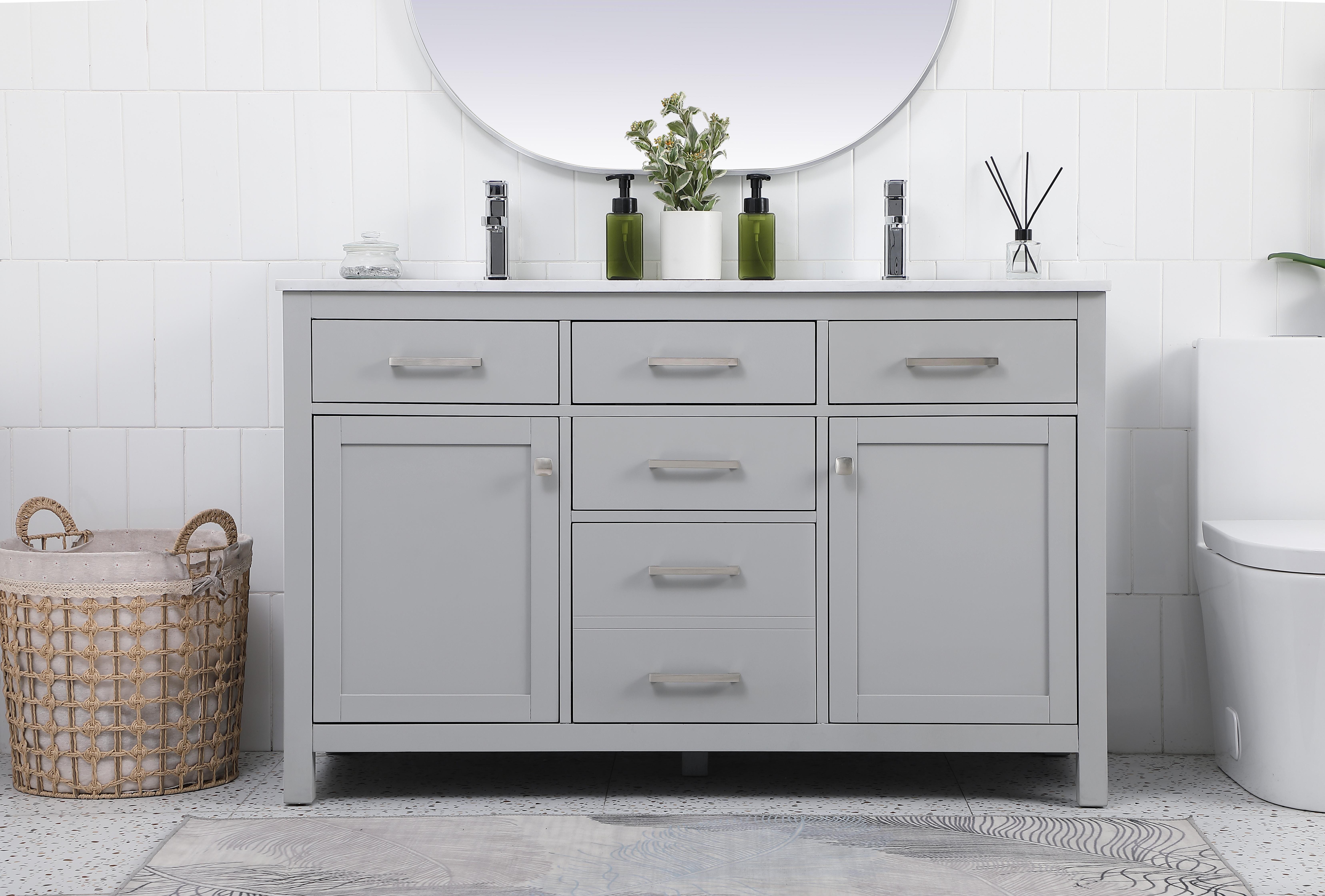 Dimensions
Length: 54"
Width: 22"
Height: 34"
Counter Top Length: 54"
Counter Top Width: 22"
Counter Top Height: 0.7"
Sink Width: 16.14"
Sink Depth: 11.02"
Sink Height: 7.875"
Sink Drain Hole Size: 1.77"
Faucet Hole Spacing: 1 Hole"
Specifications
Assembly Required: NO
Base Material: MDF
Counter Top Edge Style: Straight
Counter Top Finish: Calacatta white
Distressed Finish: NO
Drain Assembly Included: NO
Faucet Included: NO
Finish (Color): Grey
Vanity Material: Solid Wood and MDF
Hardware Finish: Brushed nickel
Harware Material: Aluminium alloy
Number of Faucet Holes: 1
Number of Sinks: 2
Product Shape: Rectangle
Product Type: Bathroom Vanities
Product Warranty: 1 year limited
Sink Mounting Type: Undermount
Vanity Backsplash: NO
Vanity Mounting Type: Free-Standing
Weight: 194
Wire Included: No
Wood Type: Rubberwood
Shipment type: LTL
US Shipping Cost: $250.00
Drawers
Drawers Included: Yes
Number of Drawers: 2
False Drawers: YES
Drawer Width: DW1: 15.83
DW2: 15.83
Drawer Depth: DW1: 14
DW2: 14
Drawer Height: DW1: 5.98
DW2: 12.91
Drawer Handle Designs: Bar pulls
Shelves
Number of Shelves: 2
Shelf Width: 16.3
18.35
Cabinets
Number of Cabinets: 2
Cabinet Interior Width: 16.3
Cabinet Interior Depth: 18.46
Cabinet Interior Height: 21.85 - alternate view