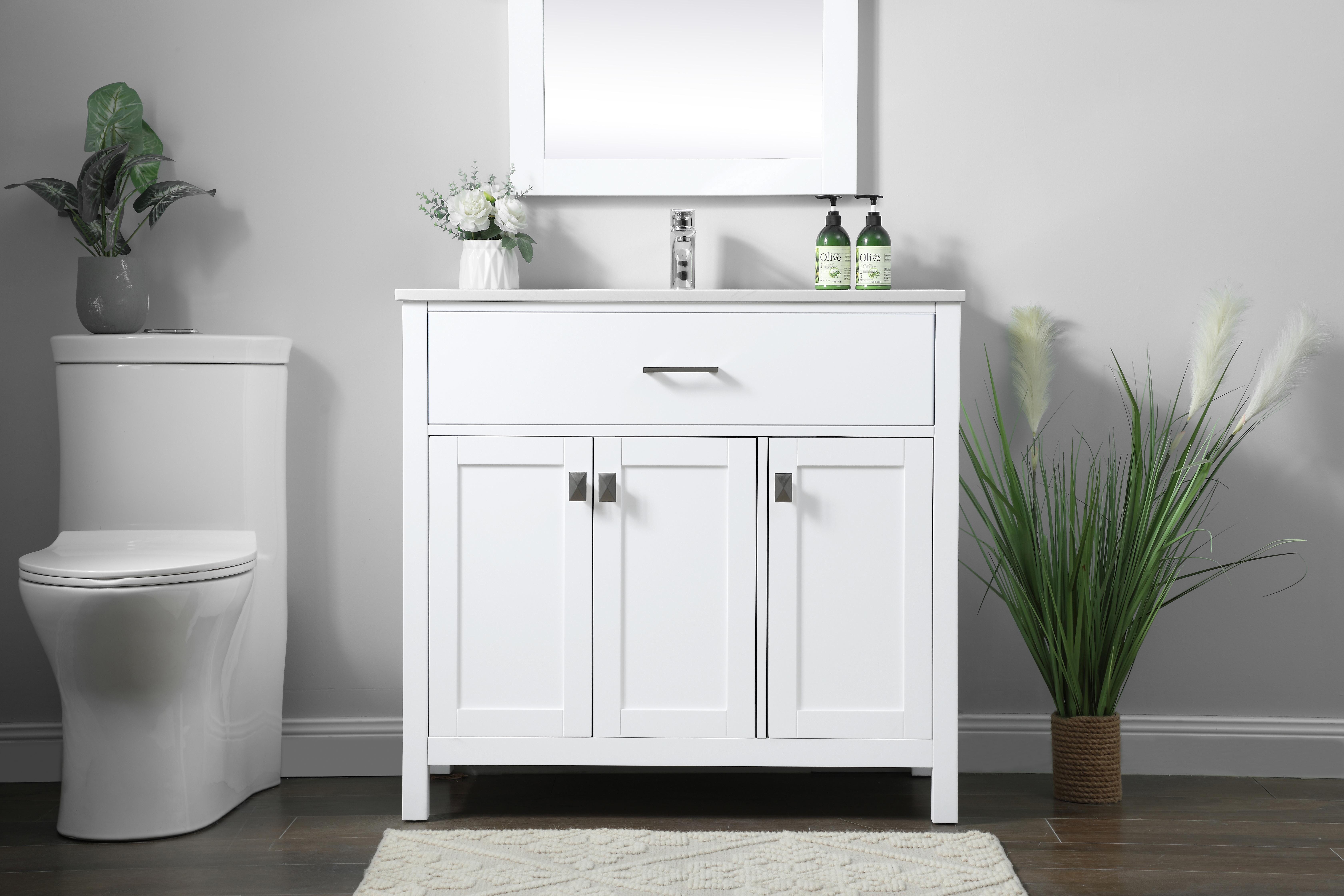 A well-designed bathroom vanity that combines clean lines with practical storage. The engineered marble top and undermount sink deliver a polished look, while soft-close cabinets and an open shelf provide versatile storage options. - alternate view