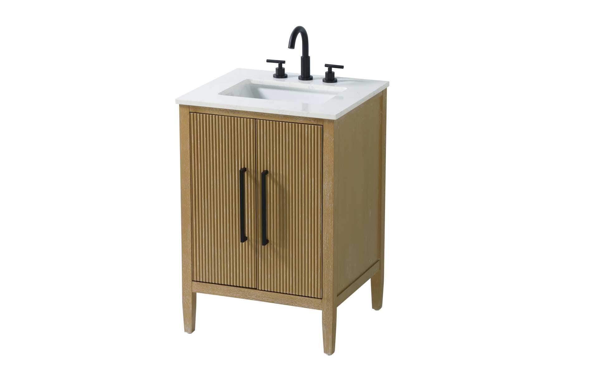 Designed with transitional elegance in mind, this bathroom vanity seamlessly blends traditional elements with modern functionality. Available in five stunning finishes, from the clean sophistication of Crisp White to the natural warmth of Honey Oak, the fluted door and drawer panels add subtle texture and charm. The white engineered marble countertop with natural veining exudes luxury, while the soft-closing doors with sleek black metal pulls offer a quiet, refined experience. Practicality is never compromised, with features like the U-shaped shelf for plumbing, and pre-drilled faucet holes for easy customization. Whether your style leans modern or classic, this vanity is the perfect balance of beauty and function, appealing to customers with a taste for quality and style. Collection: Blakely Rooms: bathroom Finish: Linen Oak Width: 21.50" Height: 35.00" Length: 24.00" Weight: 84.00 lb Material: Solid wood and MDF Country of Origin: Vietnam Manufacturer Warranty: 1 year limited - alternate view