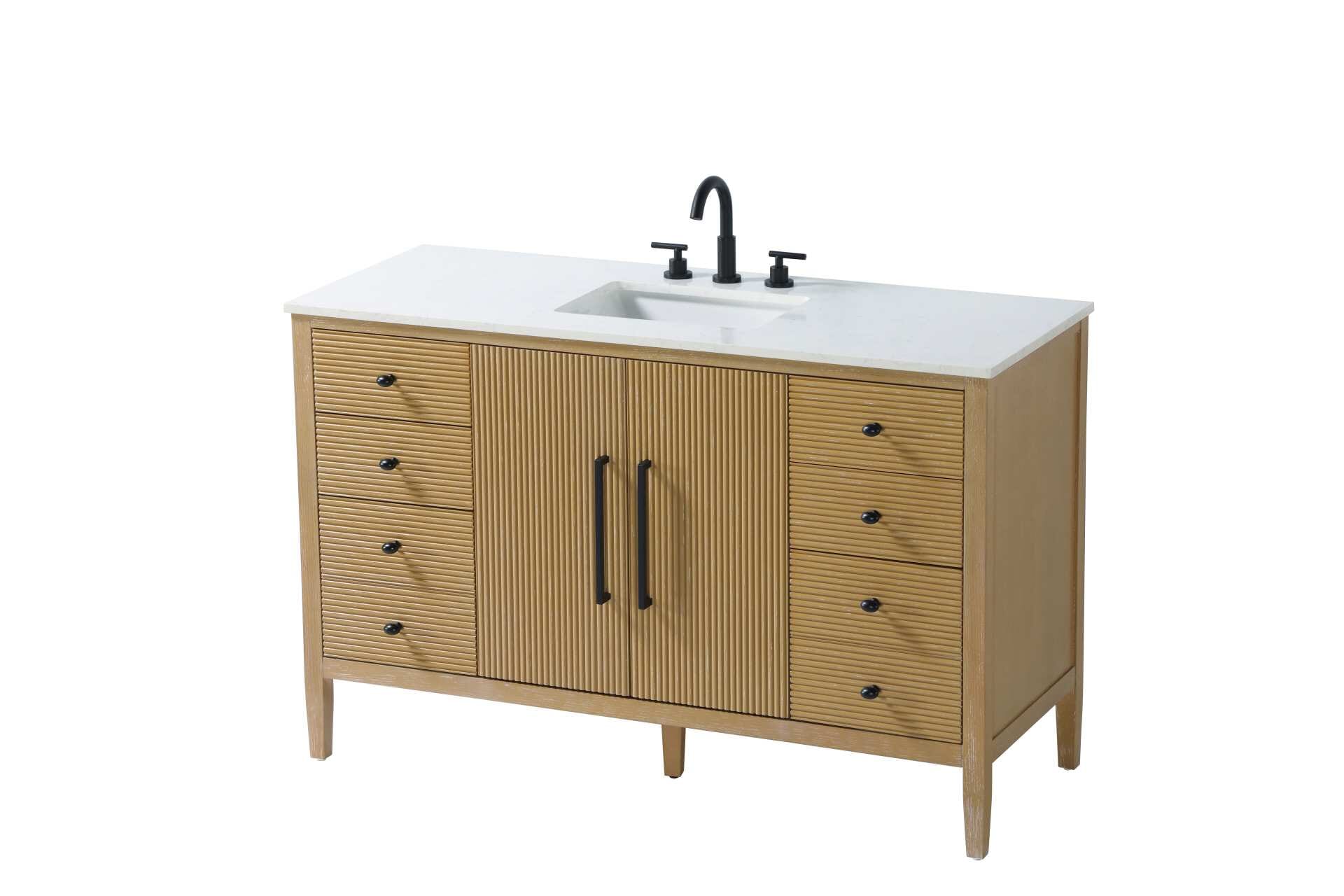 Designed with transitional elegance in mind, this bathroom vanity seamlessly blends traditional elements with modern functionality. Available in five stunning finishes, from the clean sophistication of Crisp White to the natural warmth of Honey Oak, the fluted door and drawer panels add subtle texture and charm. The white engineered marble countertop with natural veining exudes luxury, while the soft-closing doors and drawers with sleek black metal pulls offer a quiet, refined experience. Practicality is never compromised, with features like the U-shaped shelf for plumbing, deeper bottom drawer for ample storage, and pre-drilled faucet holes for easy customization. Whether your style leans modern or classic, this vanity is the perfect balance of beauty and function, appealing to customers with a taste for quality and style. Collection: Blakely Rooms: bathroom Finish: Linen Oak Width: 21.50" Height: 34.00" Length: 54.00" Weight: 217.00 lb Material: Solid wood and MDF Country of Origin: Vietnam Manufacturer Warranty: 1 year limited - alternate view